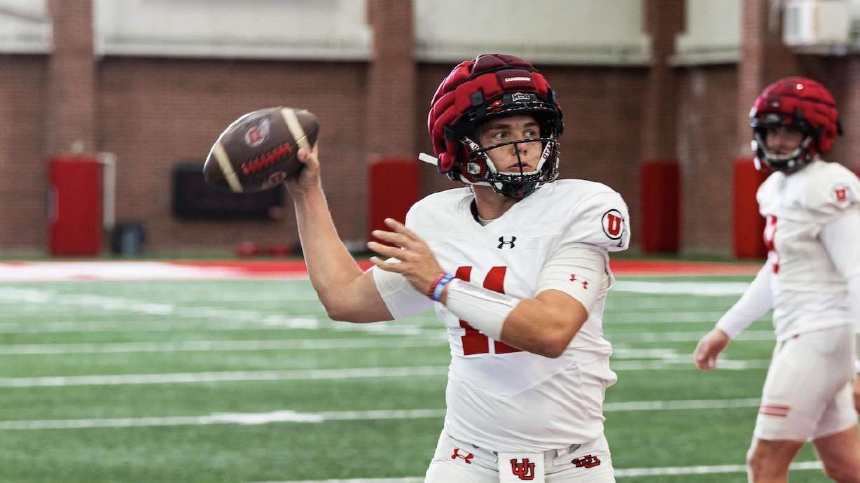 Freshman quarterback Isaac Wilson tosses a pass during spring practices in Salt Lake City.