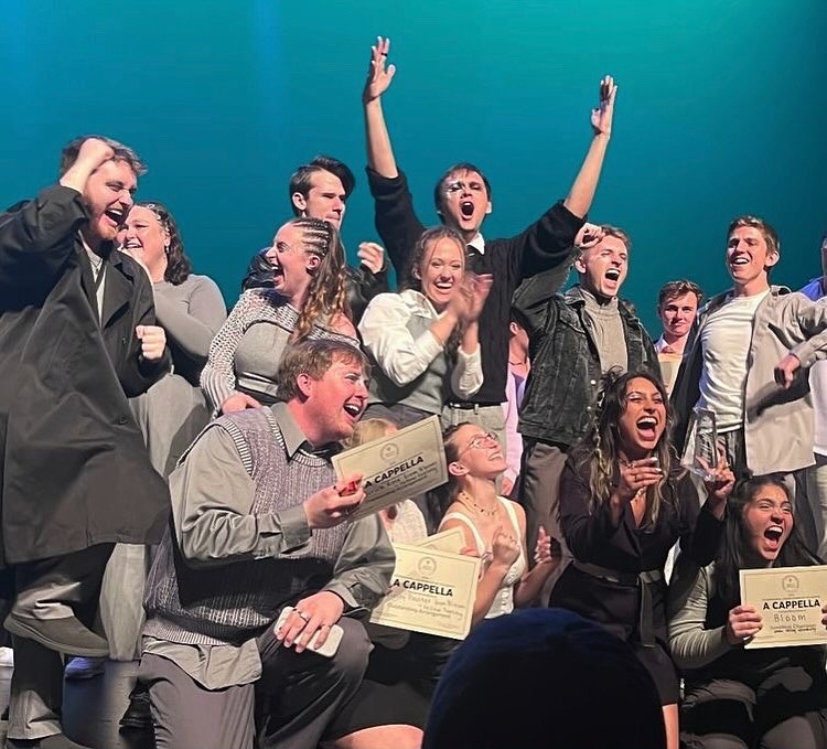 UVU a cappella group Bloom celebrates after winning the International Championship of Collegiate A Capella semifinals on March 30.