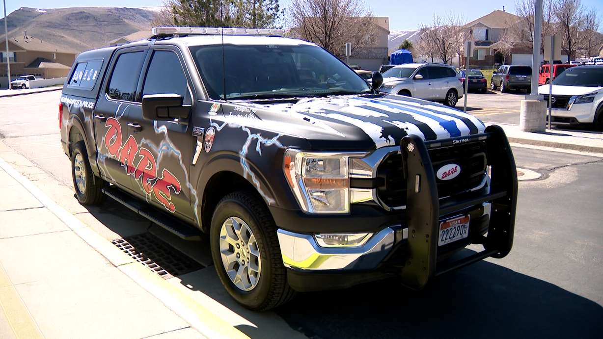 A police car is covered with fifth-grader Jaeden’s design which includes lightning bolts.