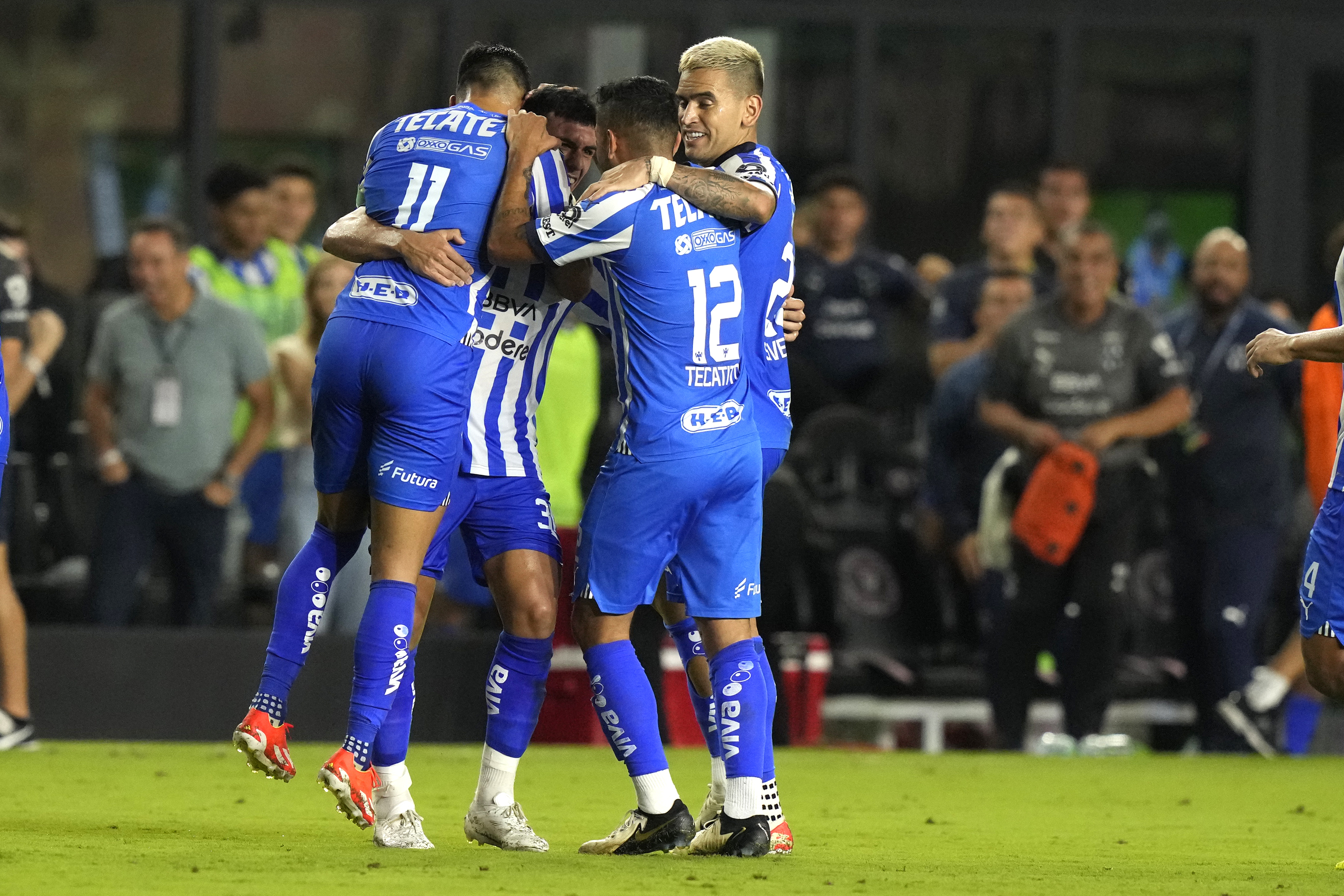 Monterrey midfielder Jorge Rodríguez, second from left, celebrates with midfielder Maximiliano Meza (11), forward Jesús Manuel Corona (12) and another teammate after scoring a goal against Inter Miami during the second half of a CONCACAF Champions Cup quarterfinal soccer match, Wednesday, April 3, 2024, in Fort Lauderdale, Fla. 