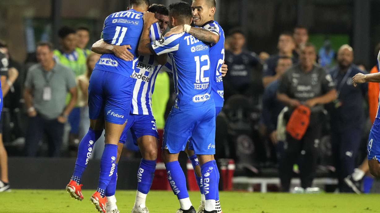 Monterrey midfielder Jorge Rodríguez, second from left, celebrates with midfielder Maximiliano Meza (11), forward Jesús Manuel Corona (12) and another teammate after scoring a goal against Inter Miami during the second half of a CONCACAF Champions Cup quarterfinal soccer match, Wednesday, April 3, 2024, in Fort Lauderdale, Fla.
