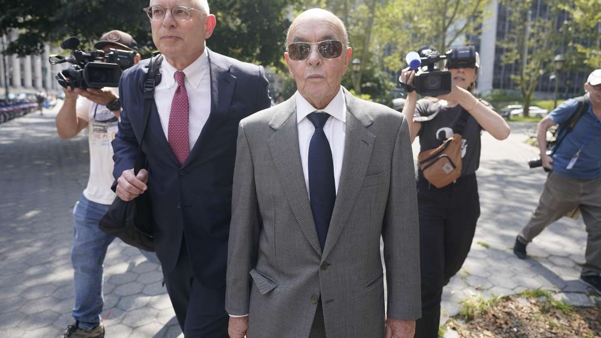 FILE - British billionaire Joe Lewis leaves, center, Manhattan federal court, Wednesday, July 26, 2023, in New York. Lewis, whose family trust owns the Tottenham Hotspur soccer club, is set to be sentenced Thursday, April 4, 2024, after pleading guilty to insider trading and conspiracy charges in New York. Prosecutors say in court documents that his age, medical issues and willingness to come to America to face criminal charges have earned him leniency..