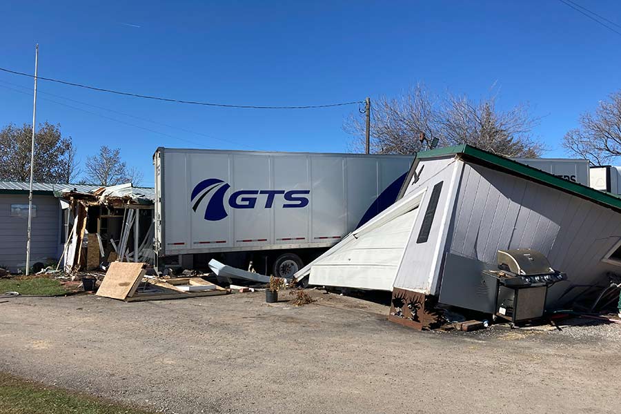 A view from the side of a house in McCammon, Idaho, after a semitruck crashed into the patio and garage on Wednesday.