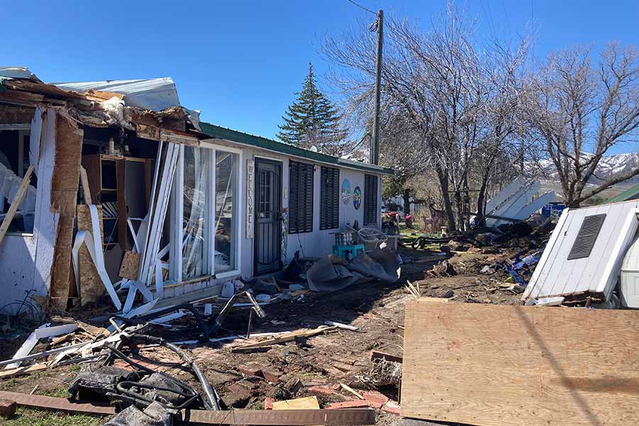 Semitruck crash narrowly misses Idaho home; destroys adjacent garage