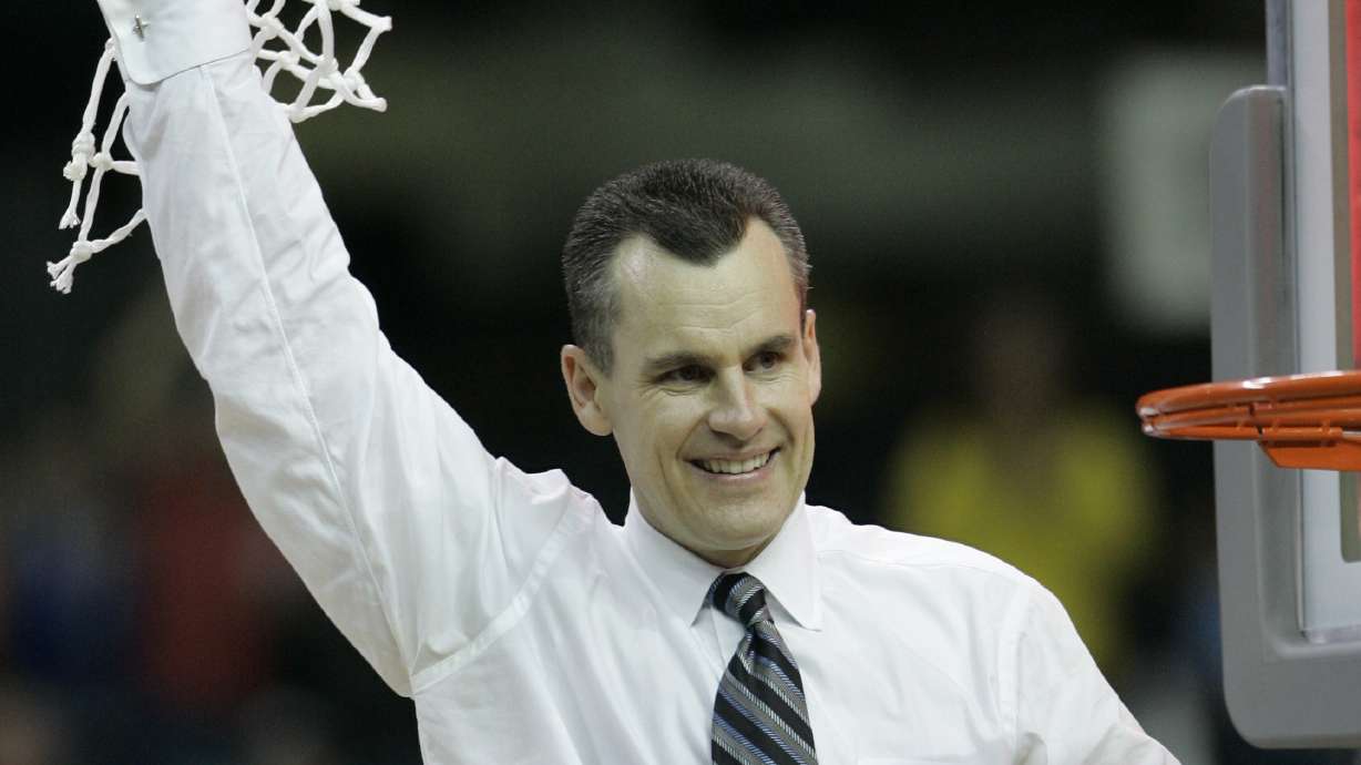 FILE - Florida coach Billy Donovan cuts down the net after his Gators defeated Ohio State 84-75 in the Final Four national basketball championship game at Georgia Dome in Atlanta, April 2, 2007. Billy Donovan hasn’t watched many UConn games. But the Chicago Bulls coach has seen enough to know the Huskies’ bid to repeat as national champions is happening in “a totally different environment.”