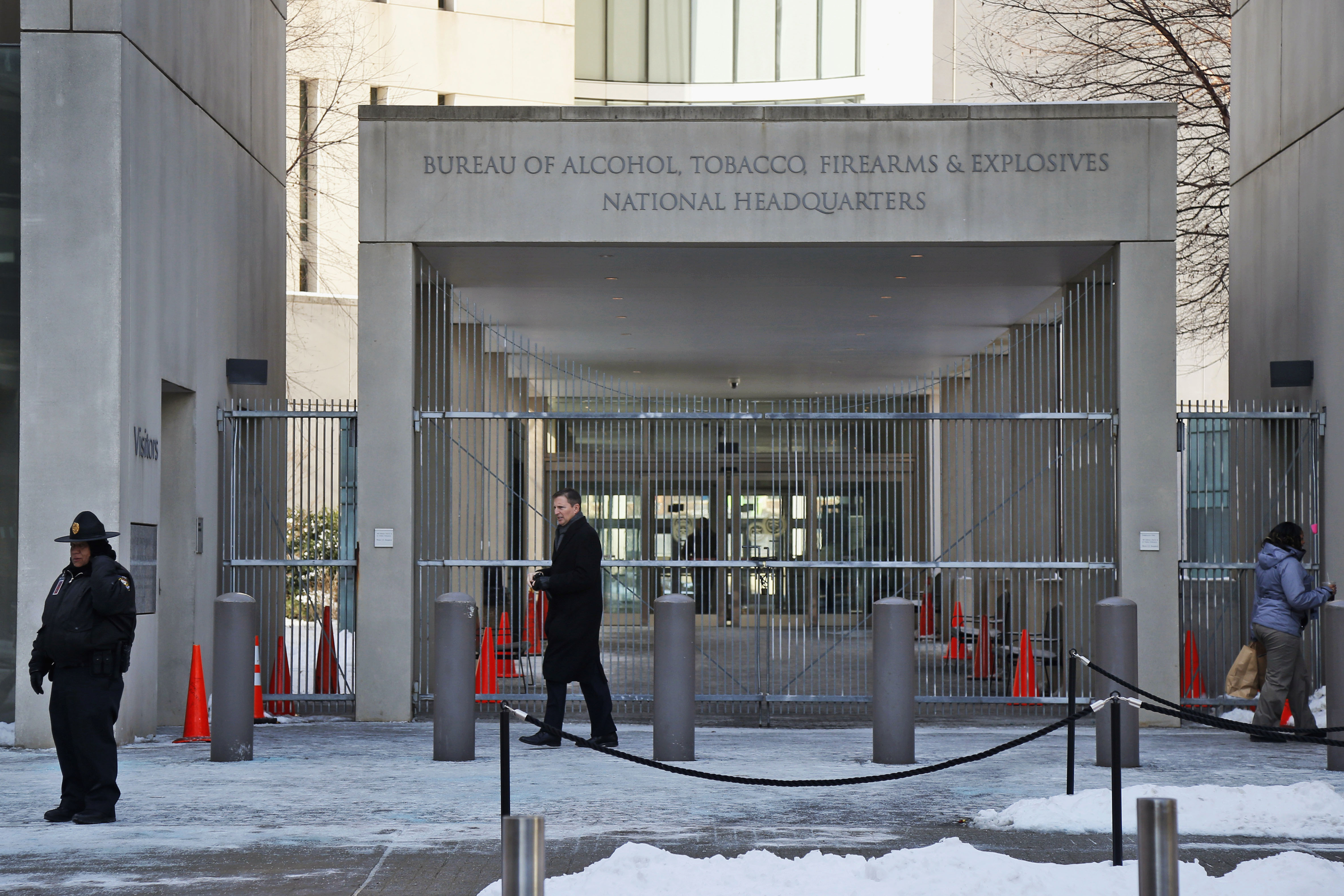 A security official walks near the Bureau of Alcohol, Tobacco, Firearms and Explosives on Jan. 23, 2014, in Washington. New data shows that 68,000 illegally trafficked firearms in the U.S. came through unlicensed dealers.