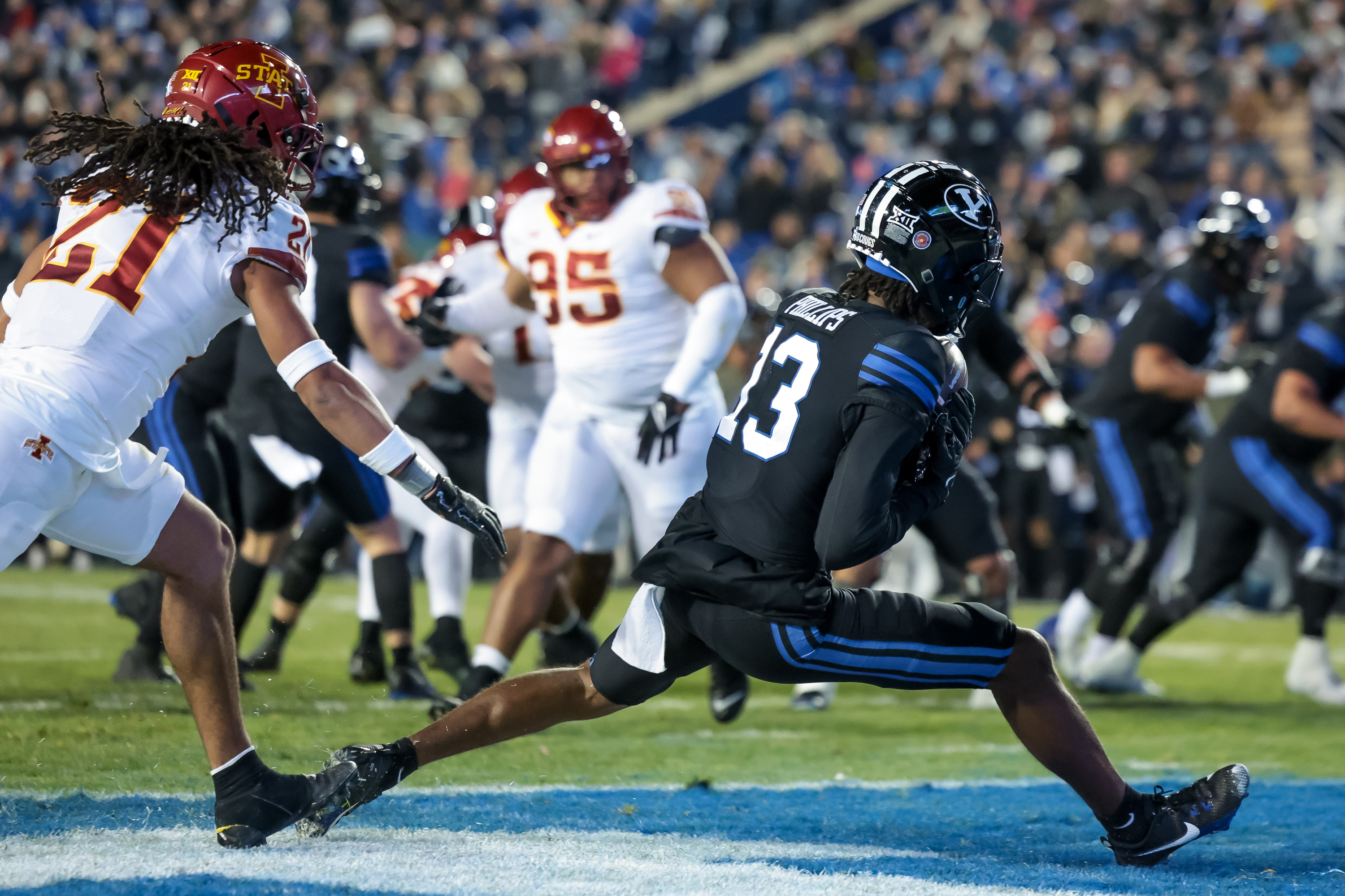 BYU wide receiver Jojo Phillips (13) makes a touchdown catch, leaving the Iowa State Cyclones up 10-7 after the PAT, at LaVell Edwards Stadium in Provo on Saturday, Nov. 11, 2023.