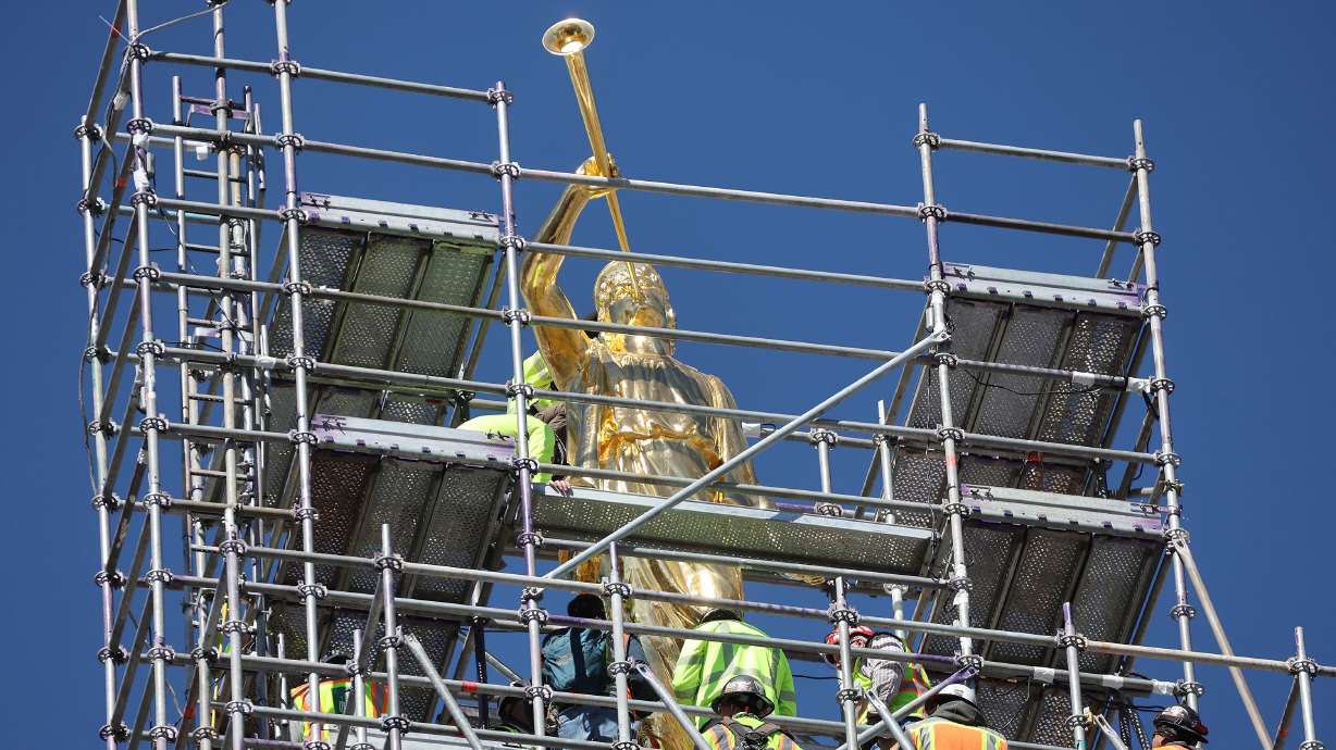 Angel Moroni is raised atop the Salt Lake Temple in Salt Lake City on Tuesday, April 2, 2024.