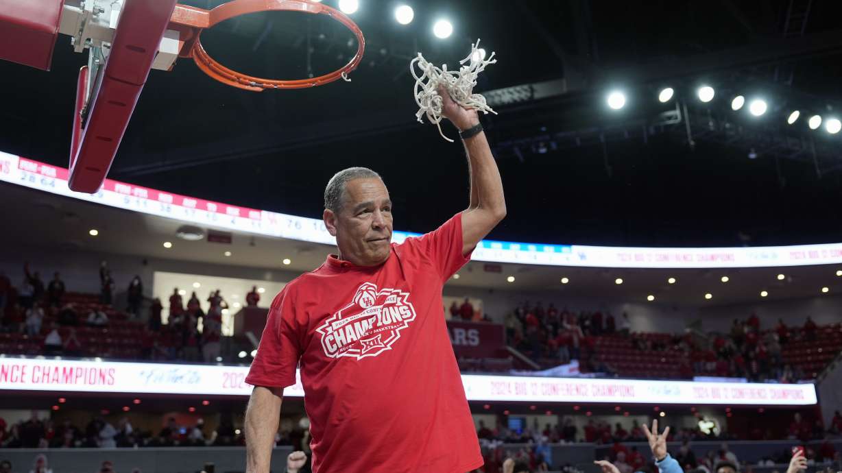 Houston coach Kelvin Sampson cuts down the net after an NCAA college basketball game against Kansas Saturday, March 9, 2024, in Houston. Houston won 76-46 and finished the regular season as the Big 12 Conference Champions.