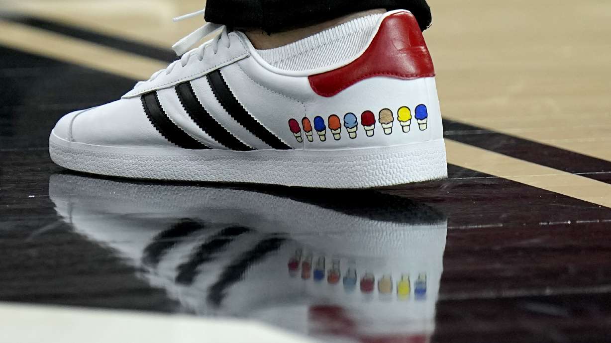 NC State head coach Kevin Keatts wears custom stitched shoes during practice ahead of a Final Four college basketball game in the NCAA Tournament, Friday, April 5, 2024, in Glendale, Ariz. North Carolina State plays Purdue.