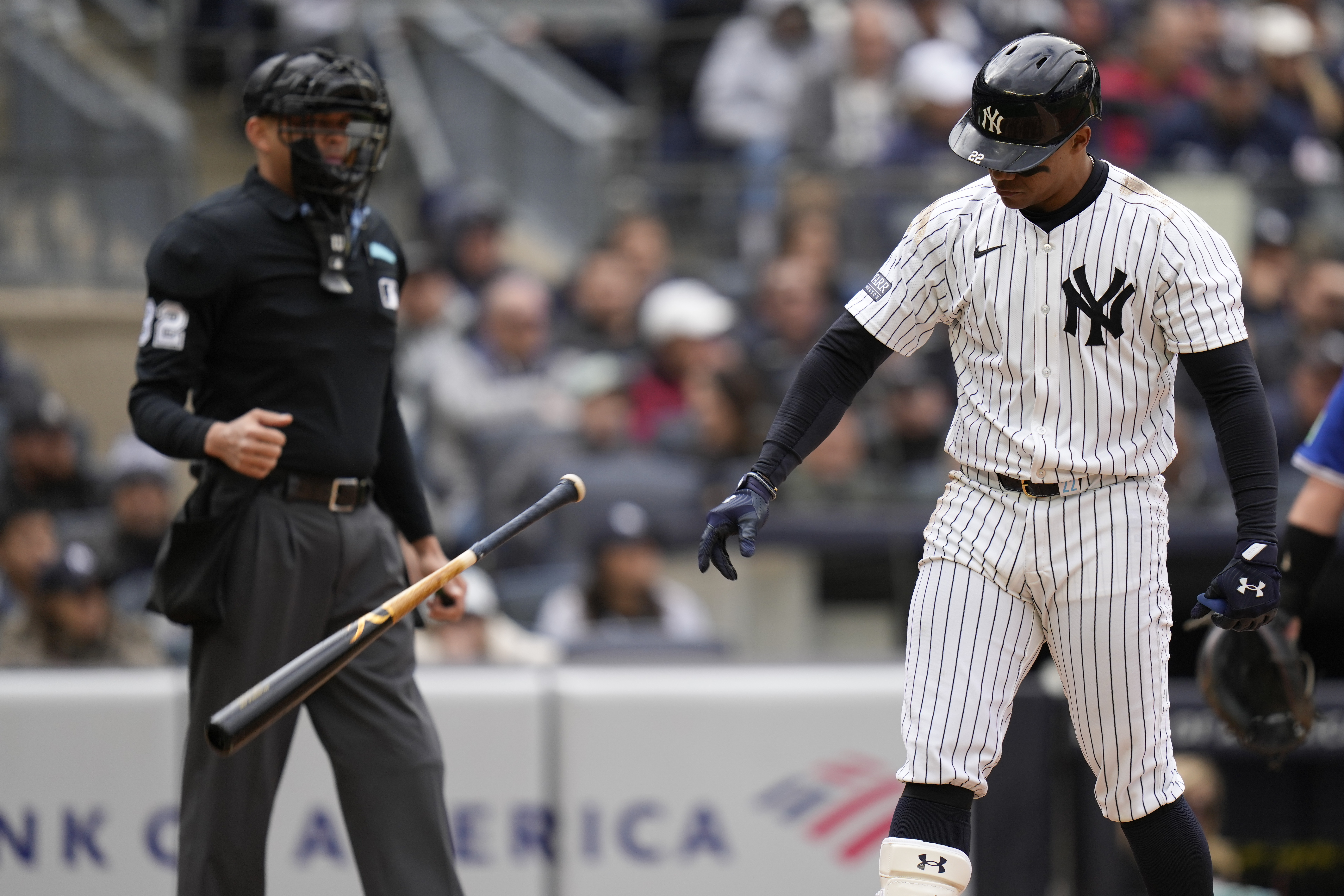 New York Yankees' Juan Soto throws his bat after striking out during the eighth inning of the baseball game against the Toronto Blue Jays at Yankee Stadium Friday, April 5, 2024, in New York. 