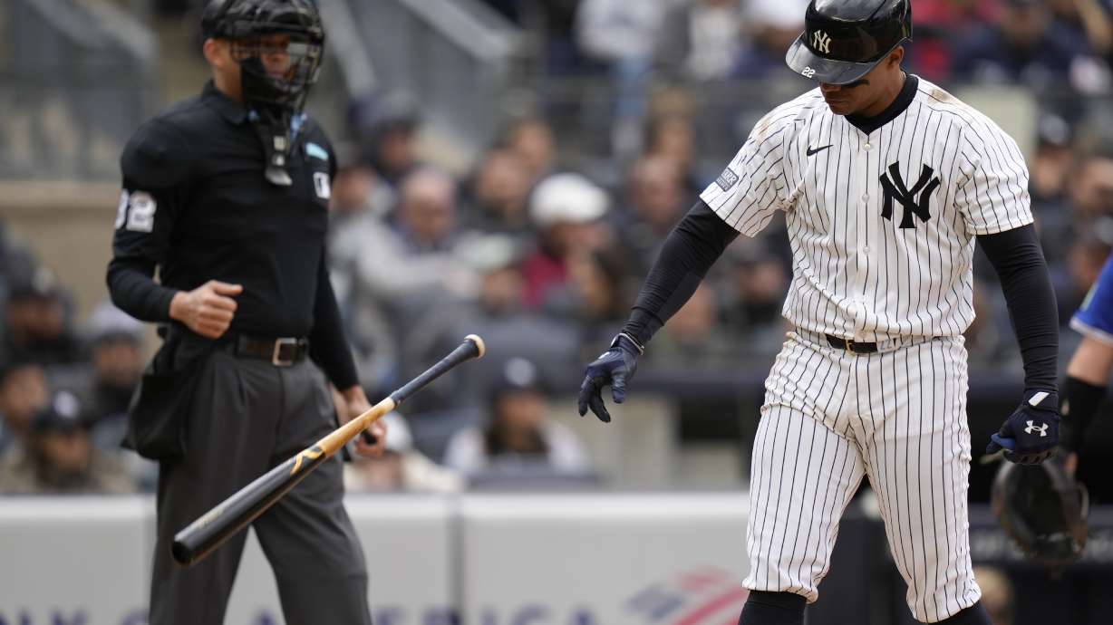 New York Yankees' Juan Soto throws his bat after striking out during the eighth inning of the baseball game against the Toronto Blue Jays at Yankee Stadium Friday, April 5, 2024, in New York.