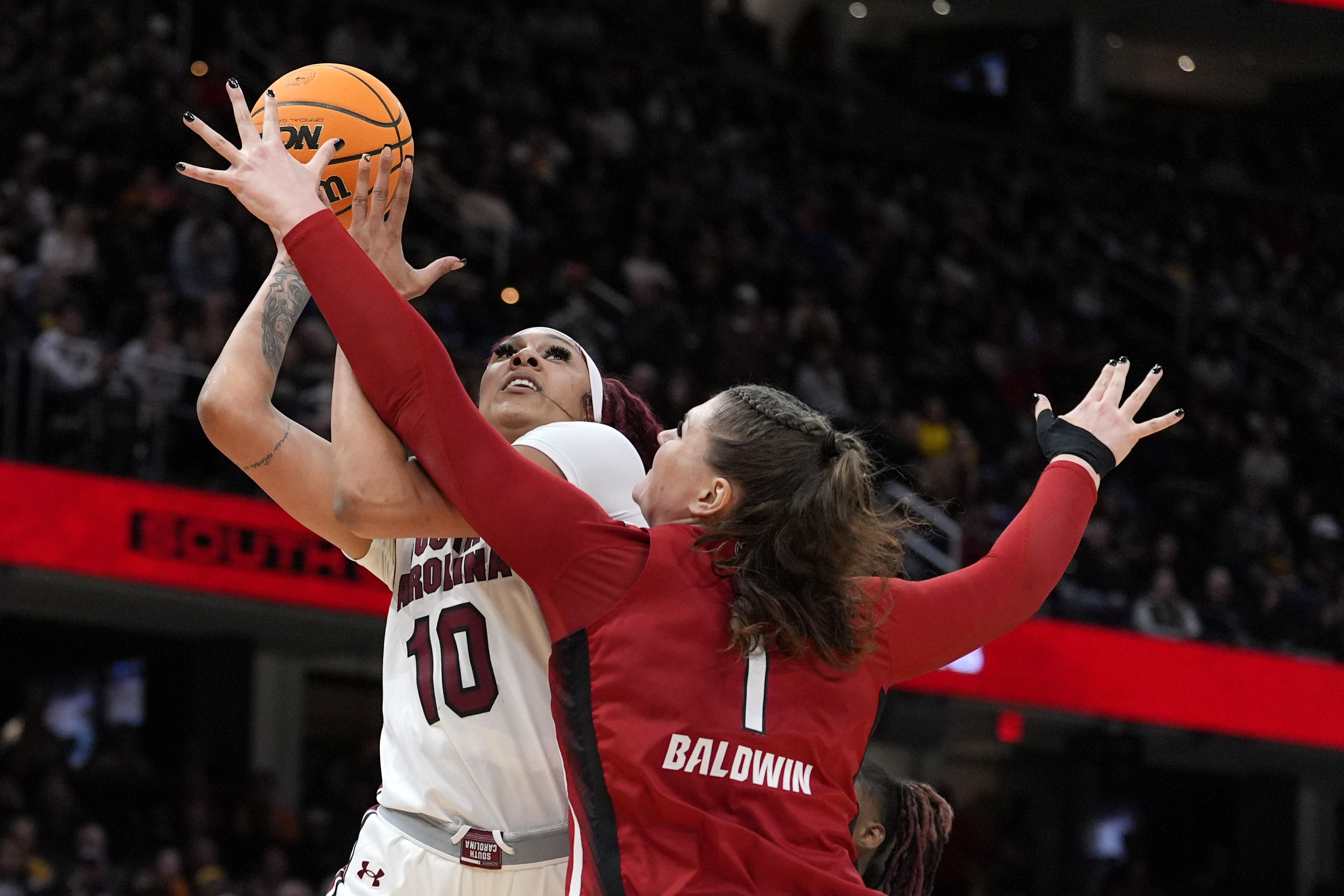 South Carolina center Kamilla Cardoso (10) shoots over North Carolina State center River Baldwin (1) during the first half of a Final Four college basketball game in the women's NCAA Tournament, Friday, April 5, 2024, in Cleveland. 