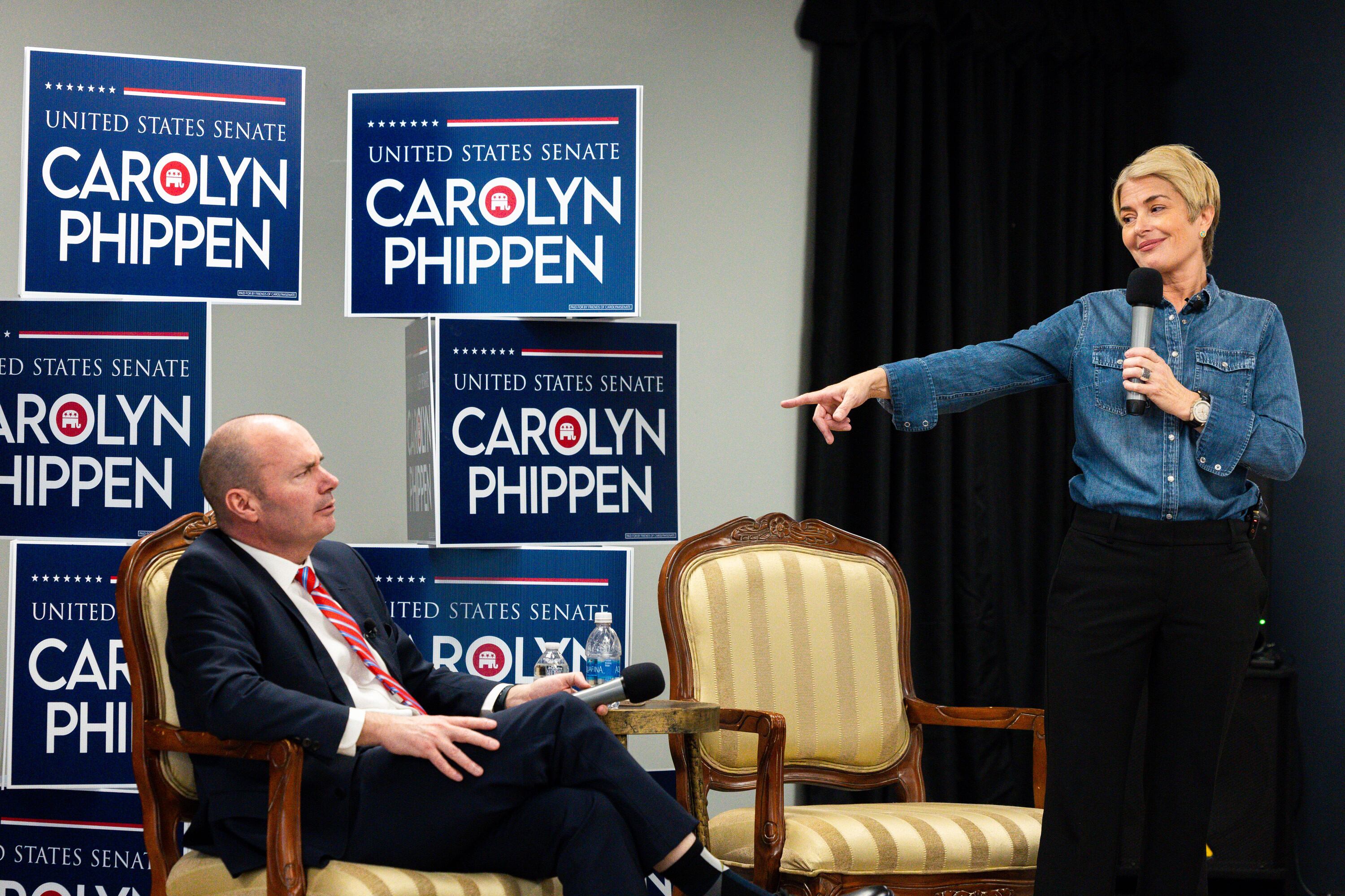 U.S. Senate candidate Carolyn Phippen points at Sen. Mike Lee at a town hall at Kimber Academy in Lindon on Friday.