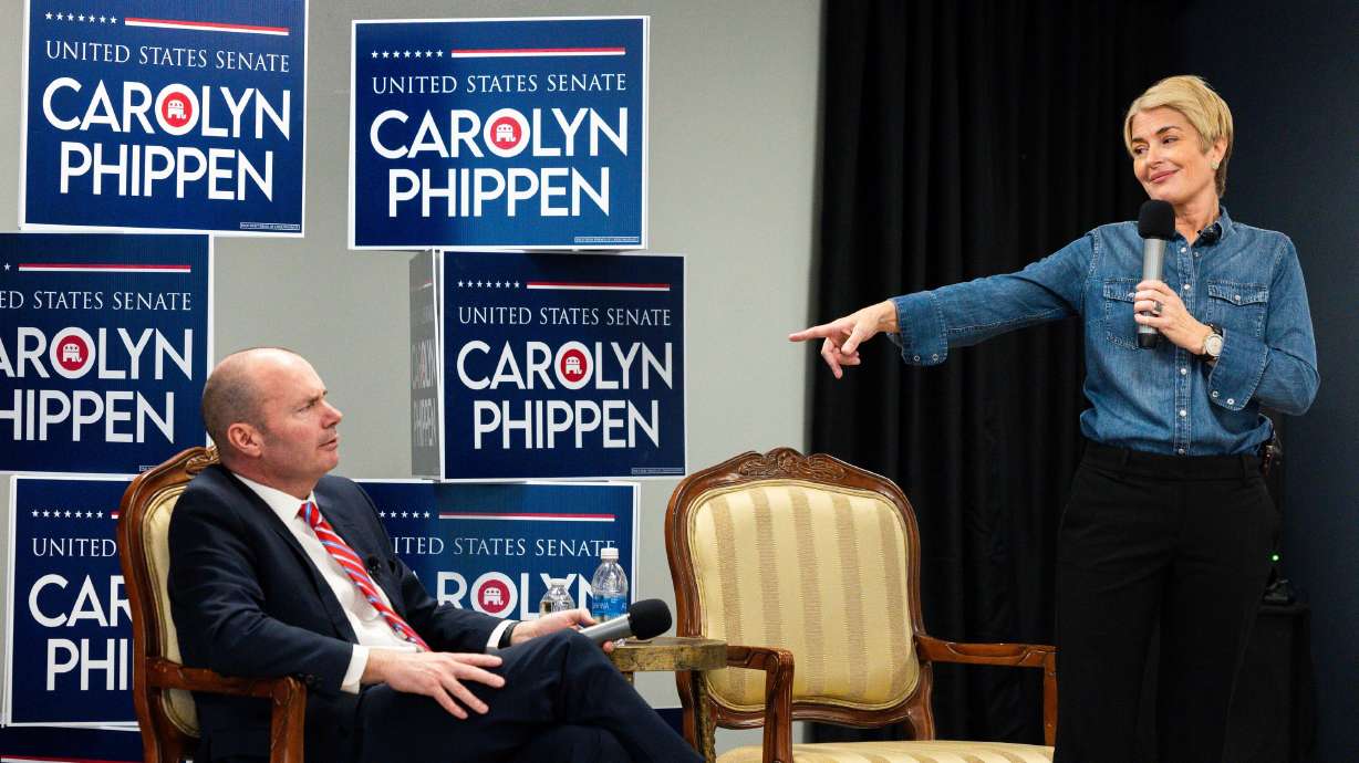U.S. Senate candidate Carolyn Phippen points at Sen. Mike Lee at a town hall at Kimber Academy in Lindon on Friday.