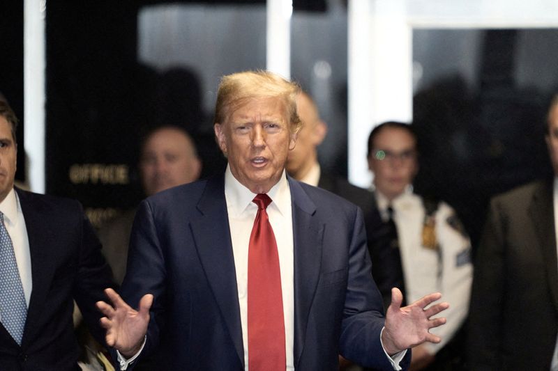 Former U.S. President Donald Trump leaves Manhattan Criminal court after a hearing in the upcoming hush money trial, in New York City, March 25.