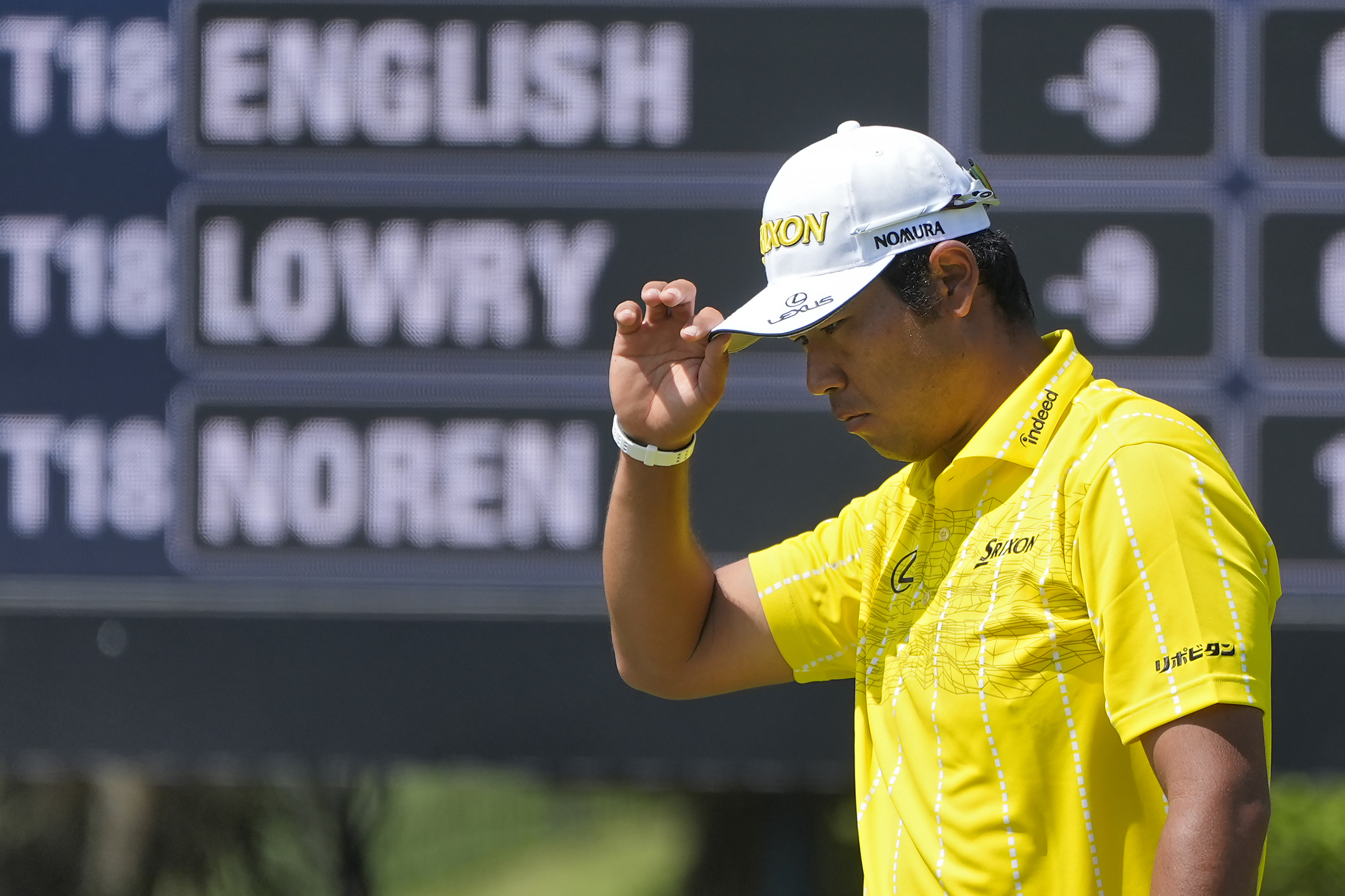 Hideki Matsuyama, of Japan, tips his cap to the gallery after putting out on the second green during the final round of The Players Championship golf tournament Sunday, March 17, 2024, in Ponte Vedra Beach, Fla. 