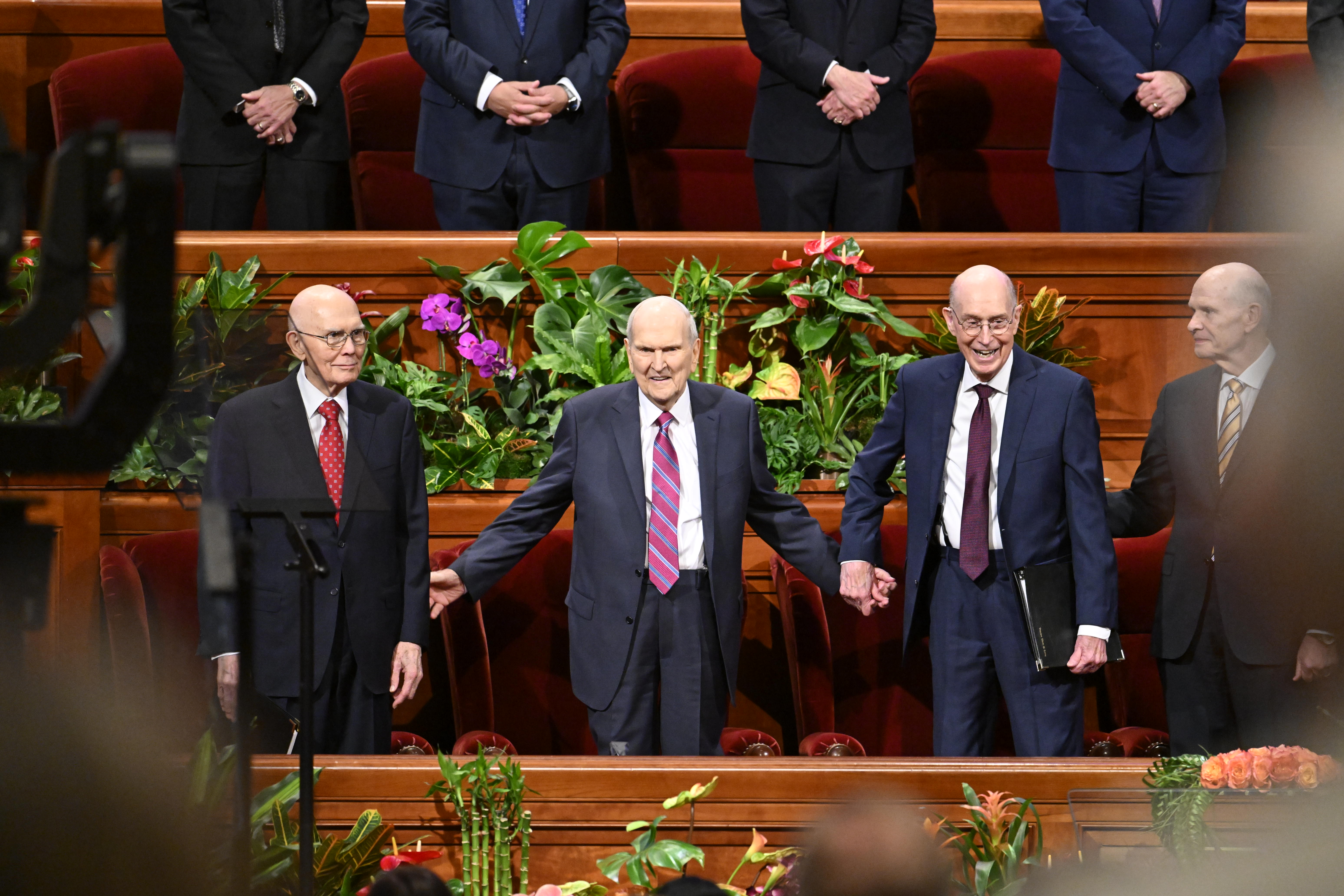 Church President Russell M. Nelson, center; President Dallin H. Oaks, first counselor in the First Presidency, left, and President Henry B. Erying, second counselor in the First Presidency, stand during the Saturday afternoon session of the 194th Annual General Conference of The Church of Jesus Christ of Latter-day Saints on Saturday.