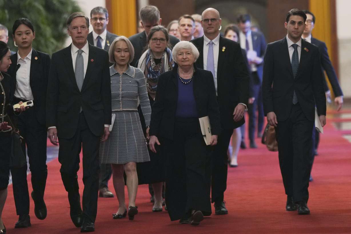 U.S. Treasury Secretary Janet Yellen walks with U.S. Ambassador to China Nicholas Burns to a meeting with Chinese Premier Li Qiang at the Great Hall of the People in Beijing, China, on Sunday. Yellen, who arrived later in Beijing after starting her five-day visit in one of China's major industrial and export hubs, said the talks would create a structure to hear each other's views and try to address American concerns about manufacturing overcapacity in China.
