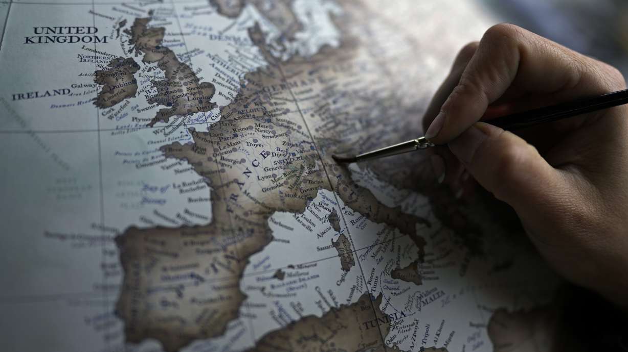 An artist paints a globe at a studio in London, Feb. 27. Globes in the age of Google Earth capture the imagination and serve as snapshots of how the owners see the world and their place in it.