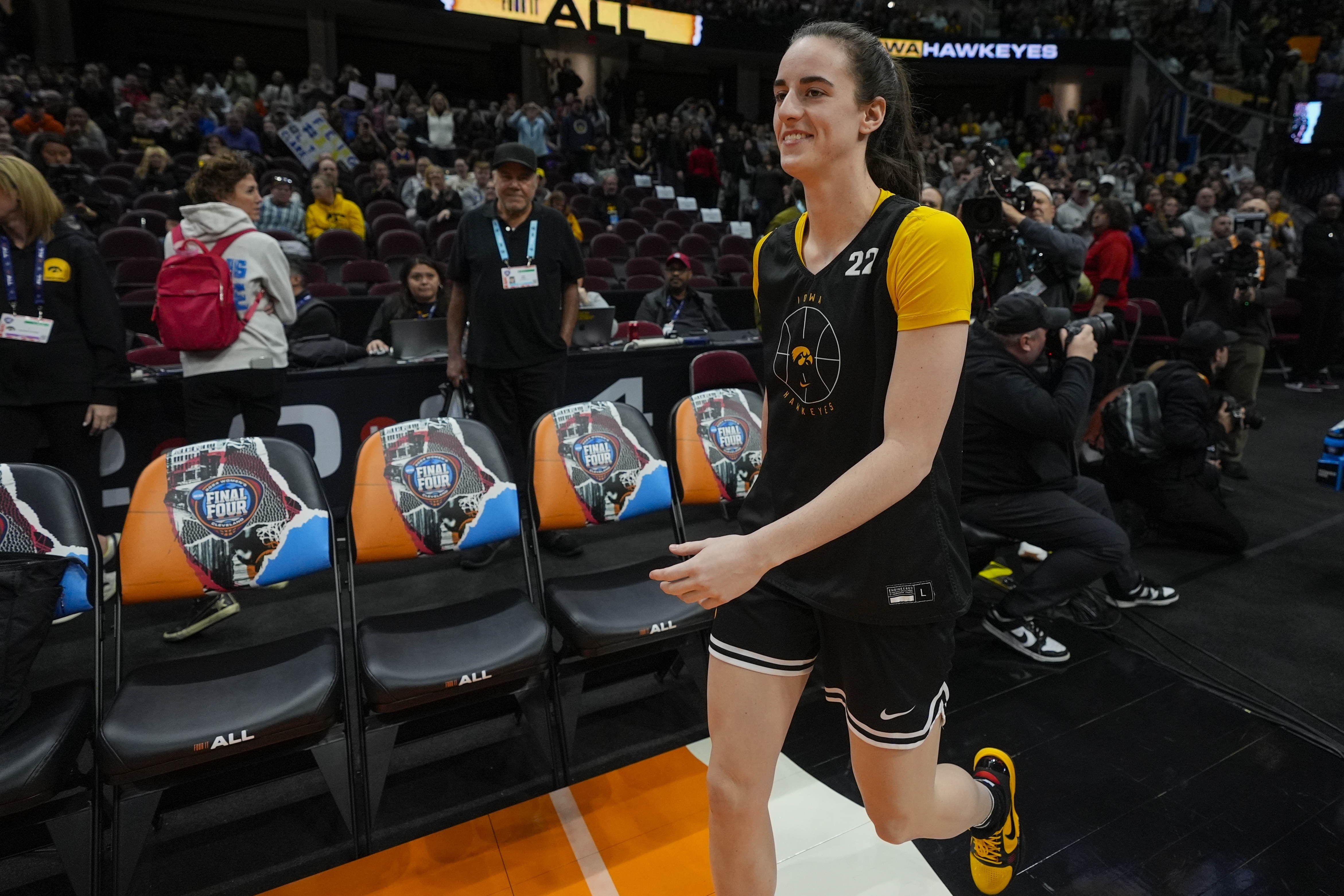 Iowa's Caitlin Clark smiles as she arrives for practice for the NCAA Women's Final Four championship basketball game Saturday, April 6, 2024, in Cleveland. 