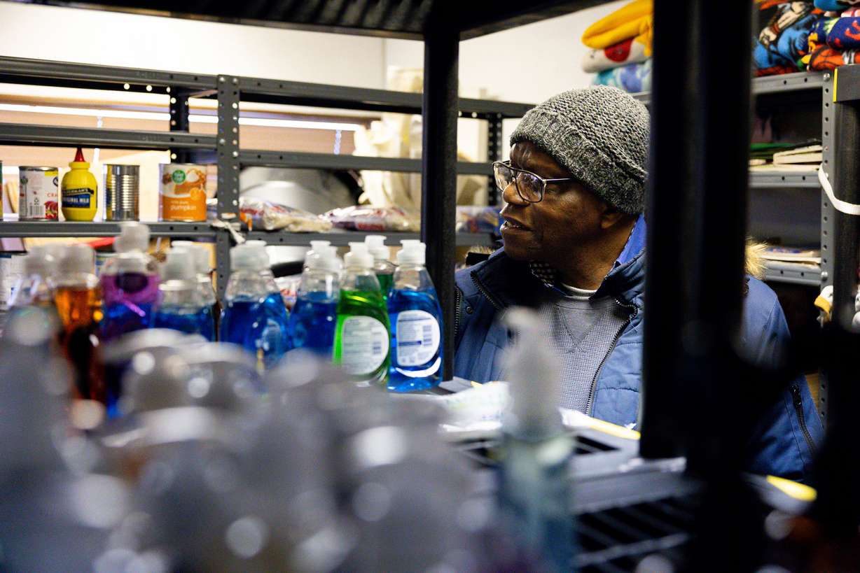 Francois Makoloh browses through donations at Utah Valley Refugees in Provo on March 26.