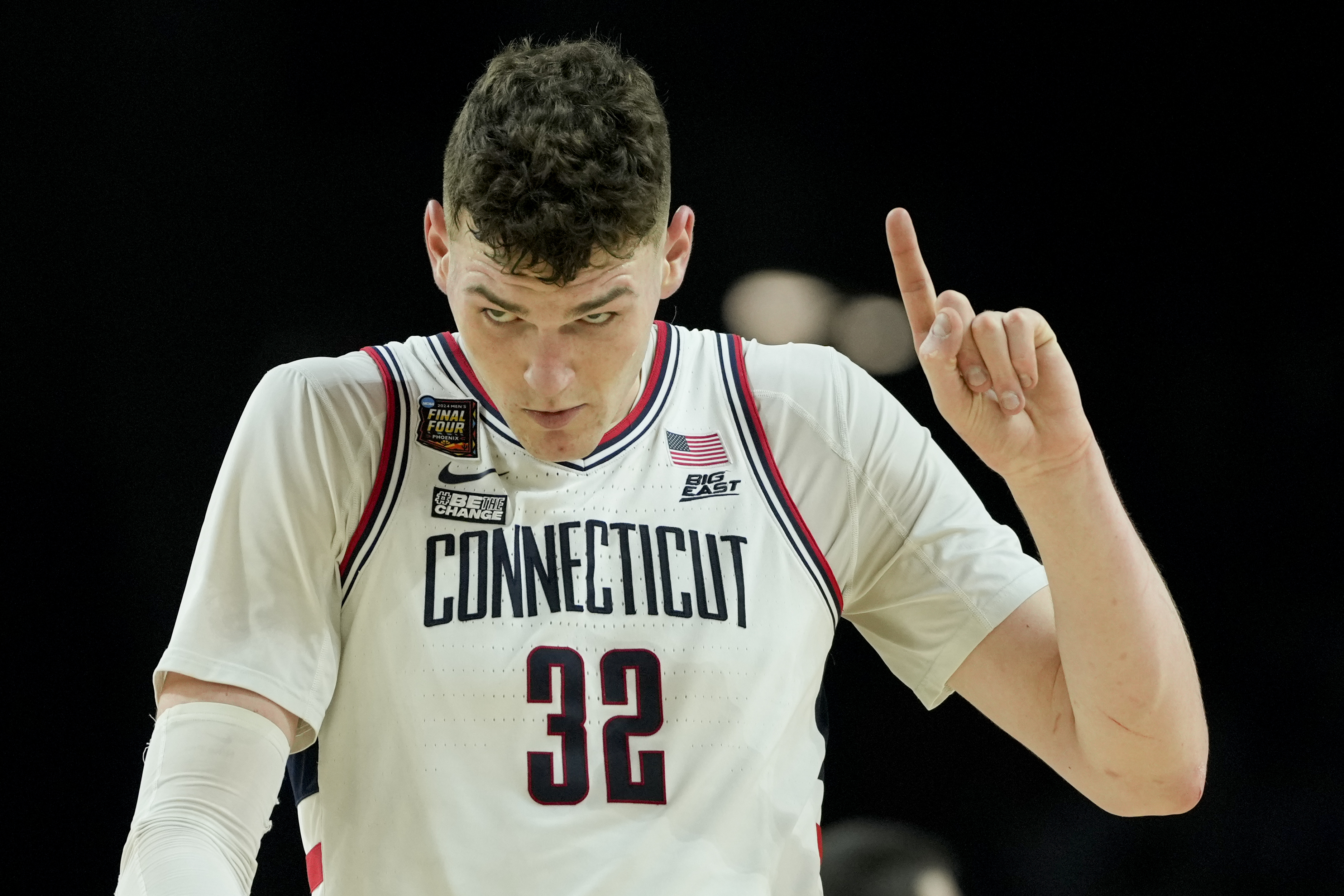 UConn center Donovan Clingan (32) celebrates after their win against Alabama in a NCAA college basketball game at the Final Four, Saturday, April 6, 2024, in Glendale, Ariz. 