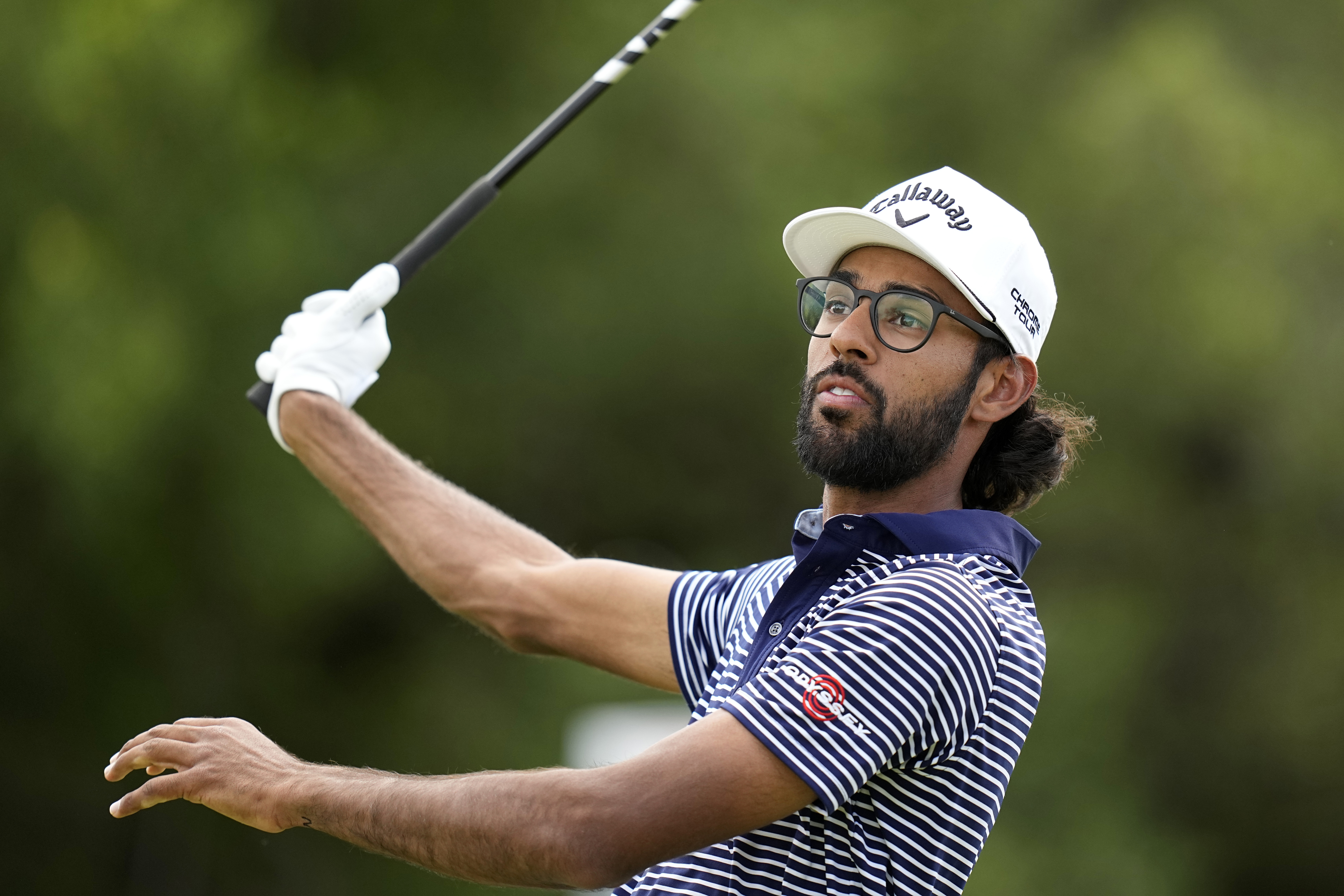 Akshay Bhatia watches his drive on the ninth hole during the final round of the Texas Open golf tournament, Sunday, April 7, 2024, in San Antonio. 