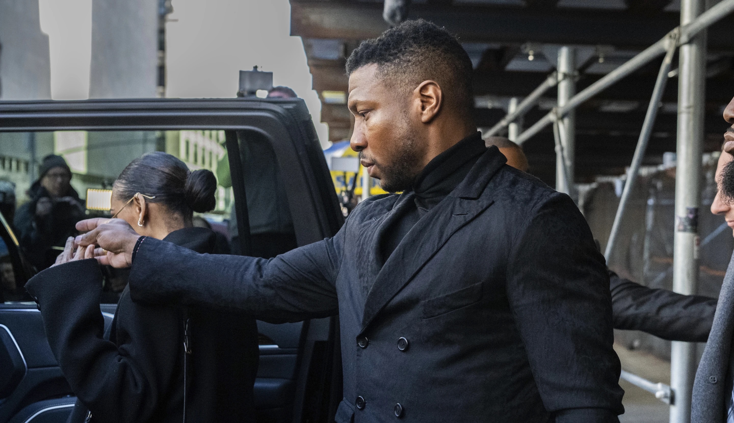 Actor Jonathan Majors leaves court Monday, after sentencing for assaulting Grace Jabbari. Majors has been ordered to complete a yearlong counseling program but avoided jail time.
