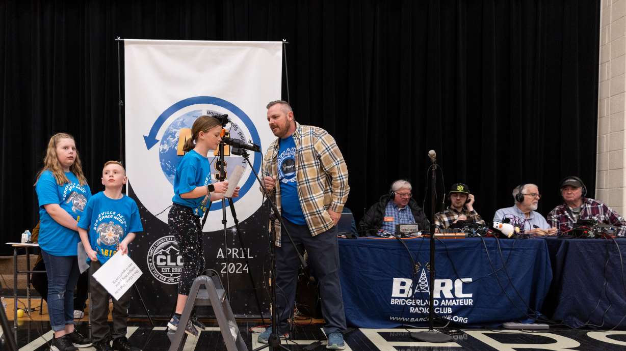 Tater Thomsen asks astronaut Mike Barratt a question through a radio at Blue Peak High School in Tooele, on Monday. Students from six different schools and charters were able to pose questions for Barratt.