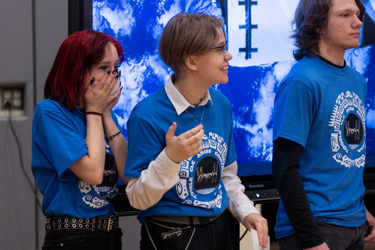 Aaliyah Rigby and Abbey Anderson react when contact is made with astronaut Mike Barratt over a radio at Blue Peak High School in Tooele, on Monday.
