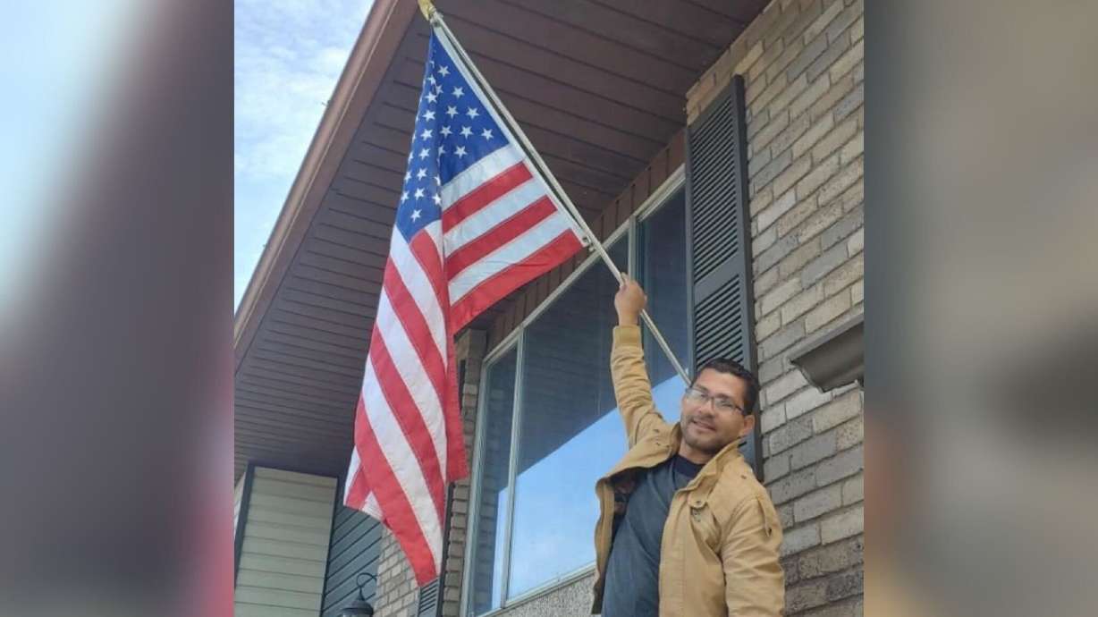 Alberto Marcano, originally from Venezuela and more recently of Provo, is shown with a U.S. flag in an undated photo. He was killed along I-15 on Thursday while changing a tire.