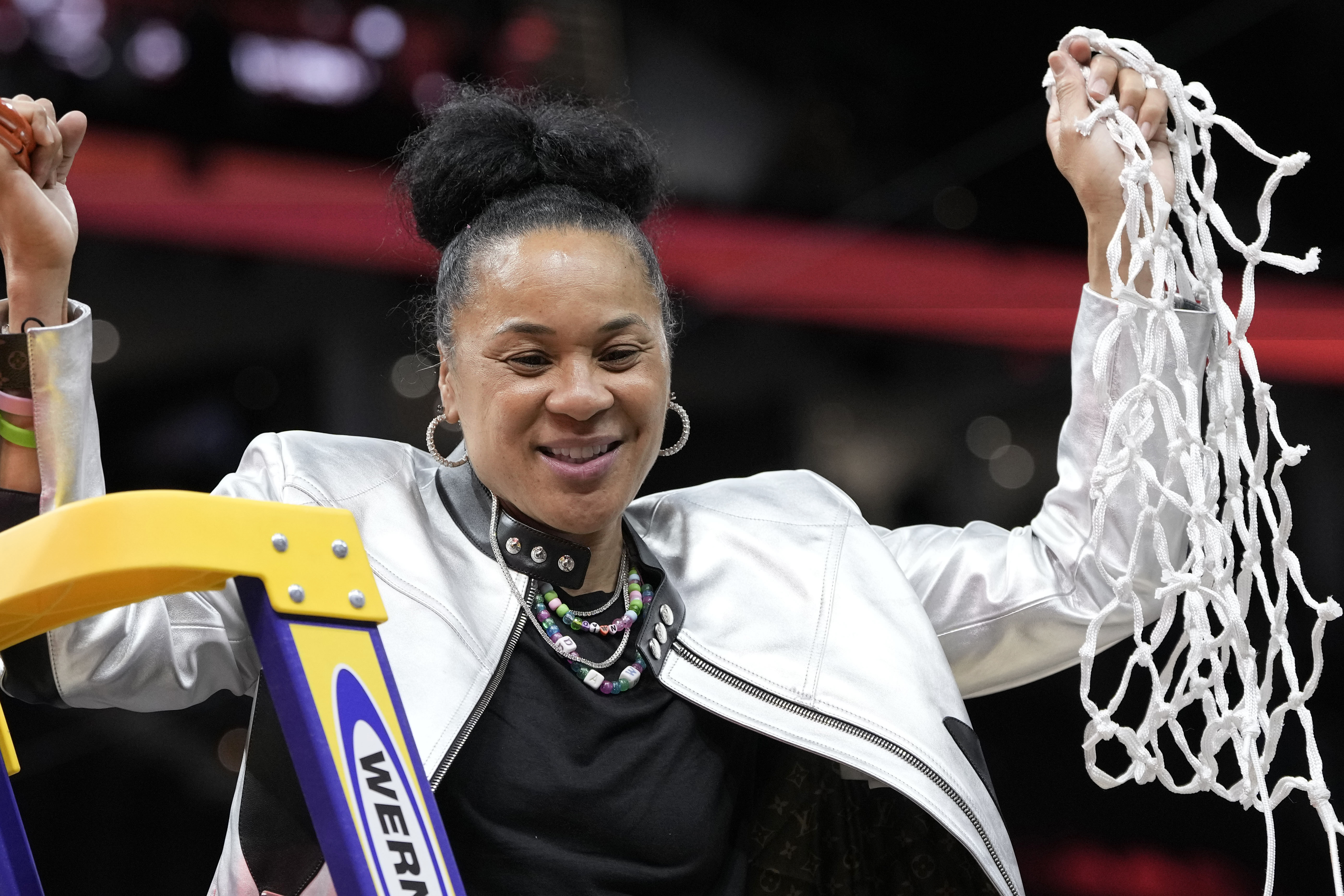 South Carolina head coach Dawn Staley cuts down the net after the Final Four college basketball championship game against Iowa in the women's NCAA Tournament, Sunday, April 7, 2024, in Cleveland. South Carolina won 87-75. 