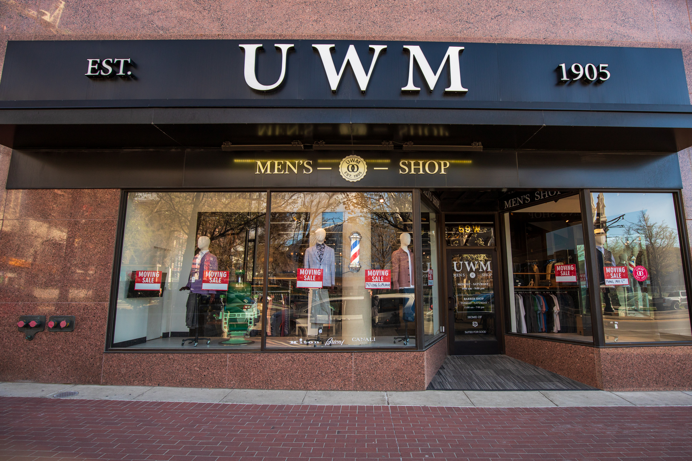 Signs promoting a "closing sale" are posted UWM Men's Shop in downtown Salt Lake City Monday. The business formerly known as Utah Woolen Mills, is slated to move to Murray before the building is torn down later this year.