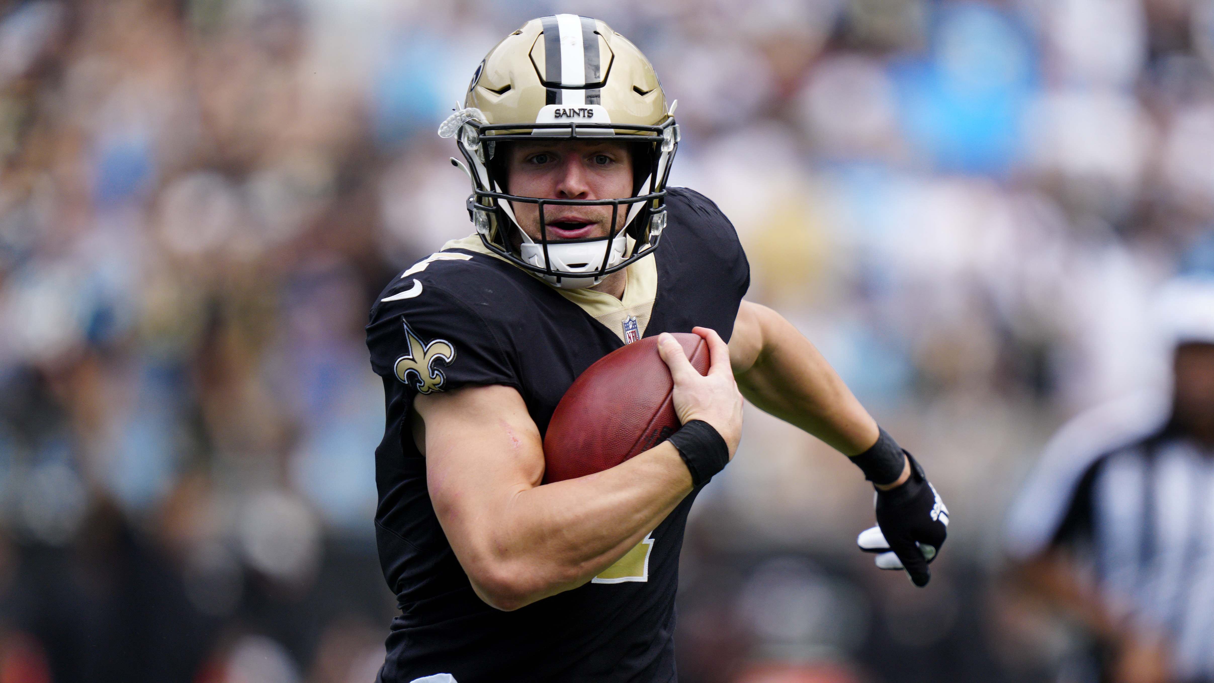 New Orleans Saints quarterback Taysom Hill runs against the Carolina Panthers during a game, Sept. 19, 2021, in Charlotte, N.C.