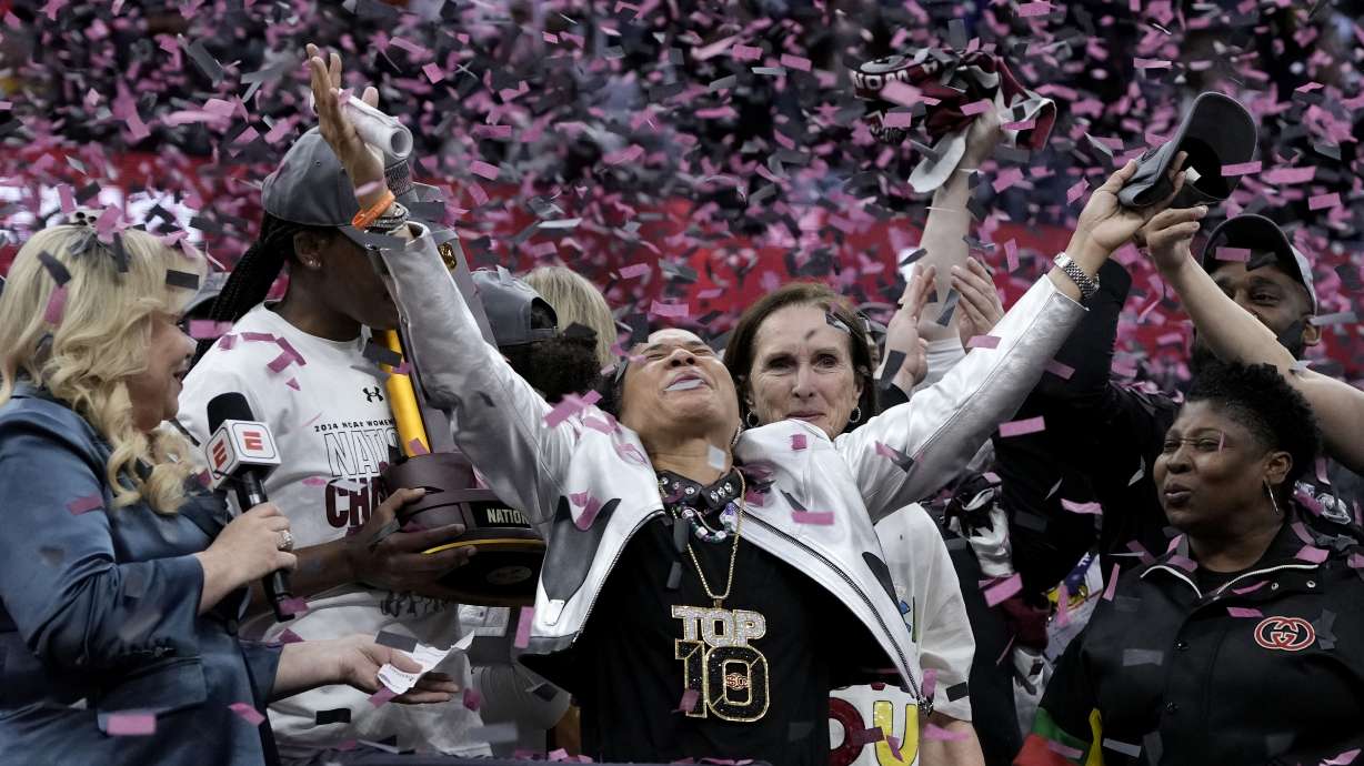 South Carolina head coach Dawn Staley celebrates after the Final Four college basketball championship game against Iowa in the women's NCAA Tournament, Sunday, April 7, 2024, in Cleveland. South Carolina won 87-75.