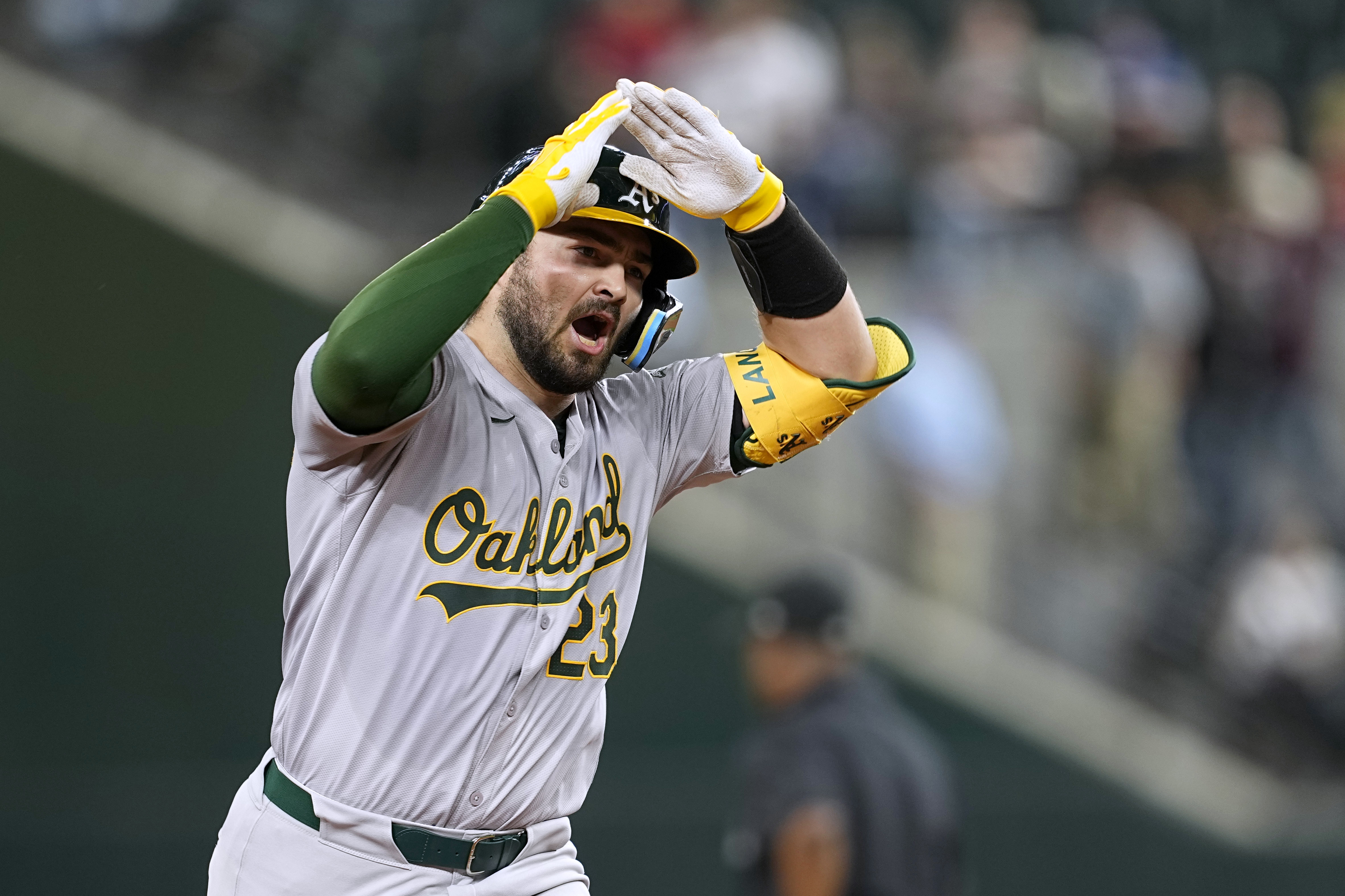 Oakland Athletics' Shea Langeliers celebrates his two-run home run against the Texas Rangers during the ninth inning of a baseball game in Arlington, Texas, Tuesday, April 9, 2024. 