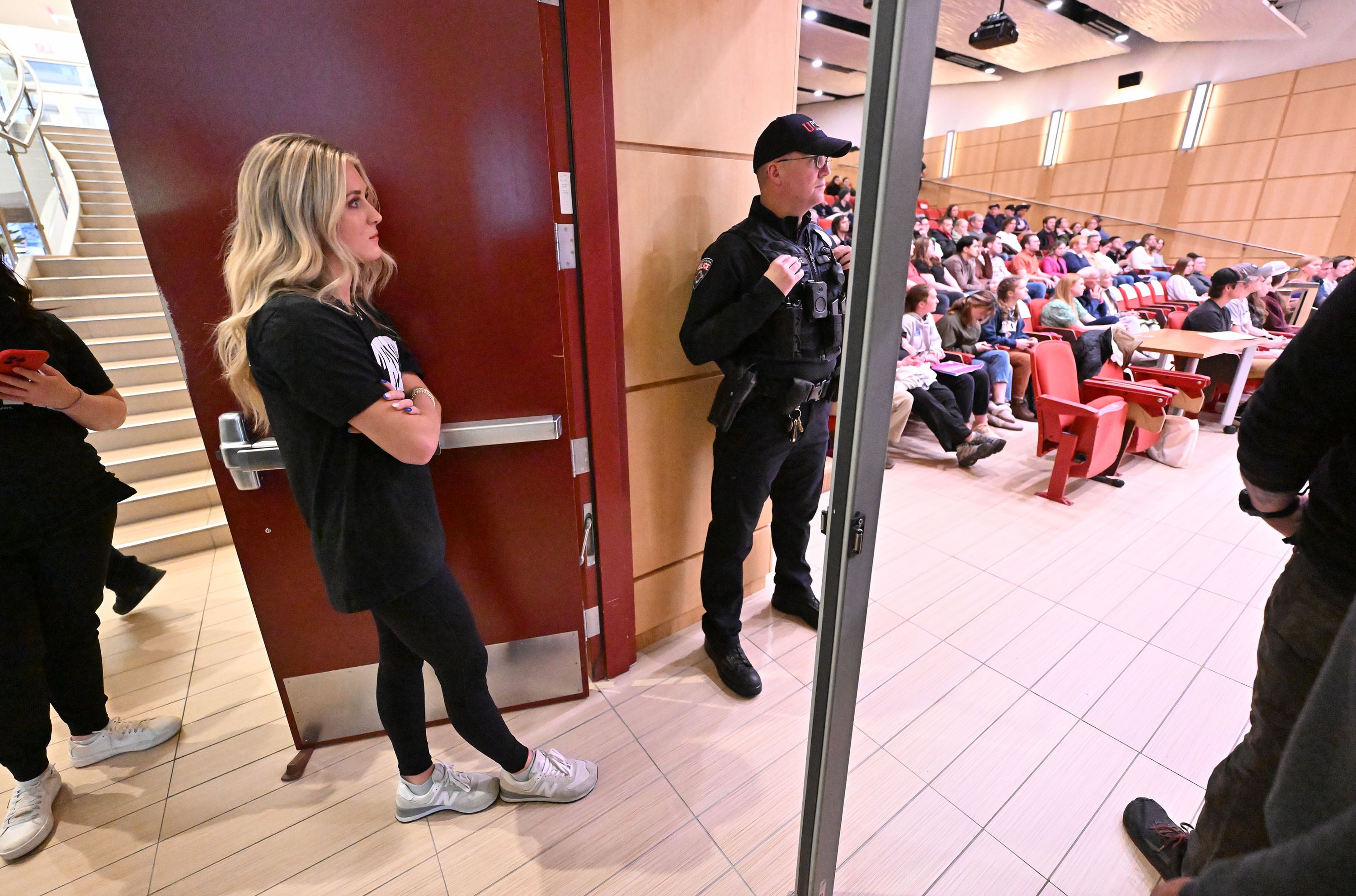 Swimmer-turned-activist Riley Gaines waits outside the auditorium prior to her speaking at the Spencer Fox Eccles Business Building at the University of Utah in Salt Lake City about women's rights on Friday.