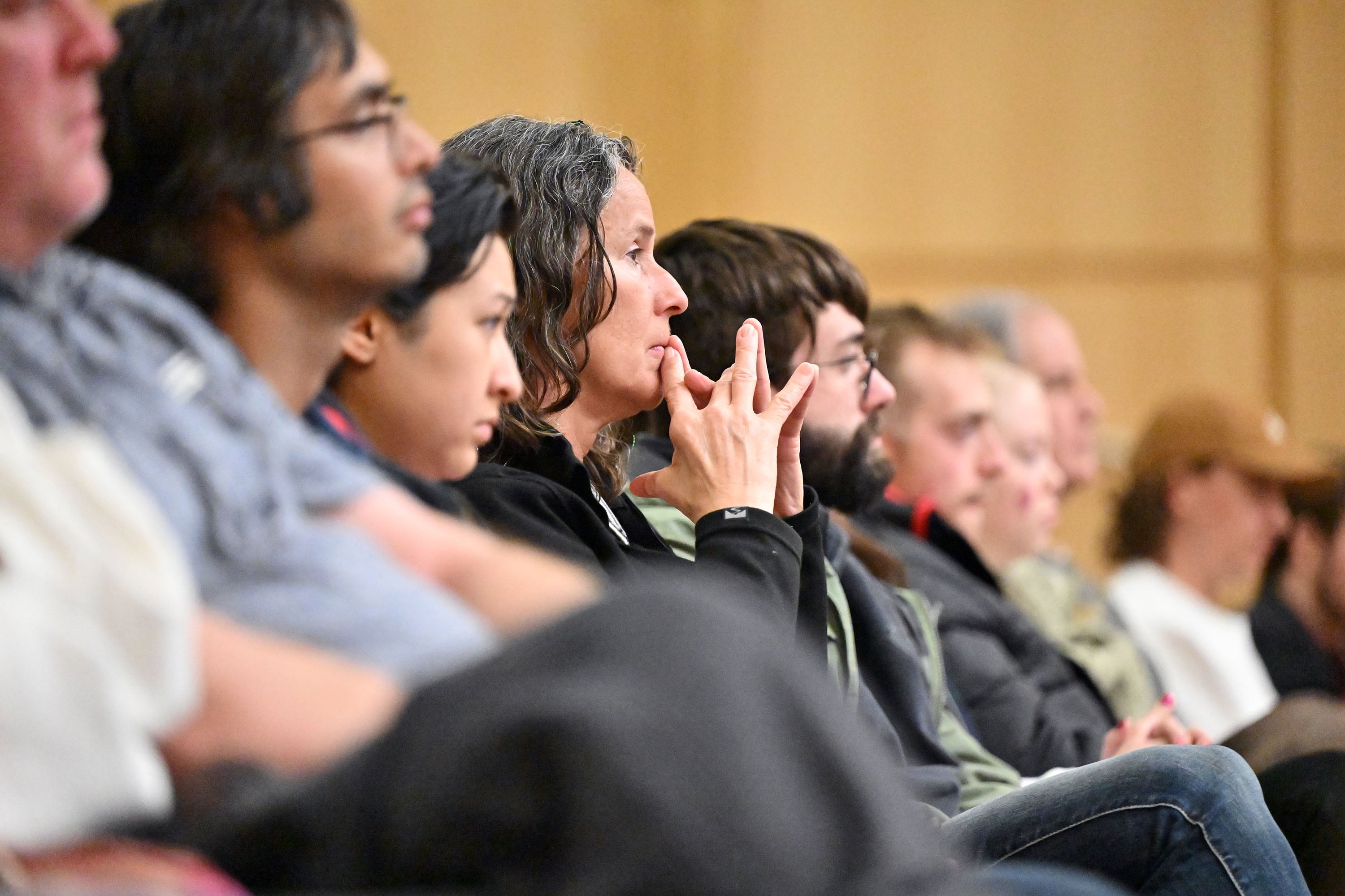 Audience members listen as swimmer-turned-activist Riley Gaines speaks at the Spencer Fox Eccles Business Building at the University of Utah in Salt Lake City about women's rights on Friday.