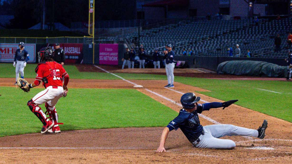 Brigham Young Cougars celebrate after their victory against the Utah Utes during a college baseball game at Smith's Ballpark in Salt Lake City on Tuesday, April 9, 2024.