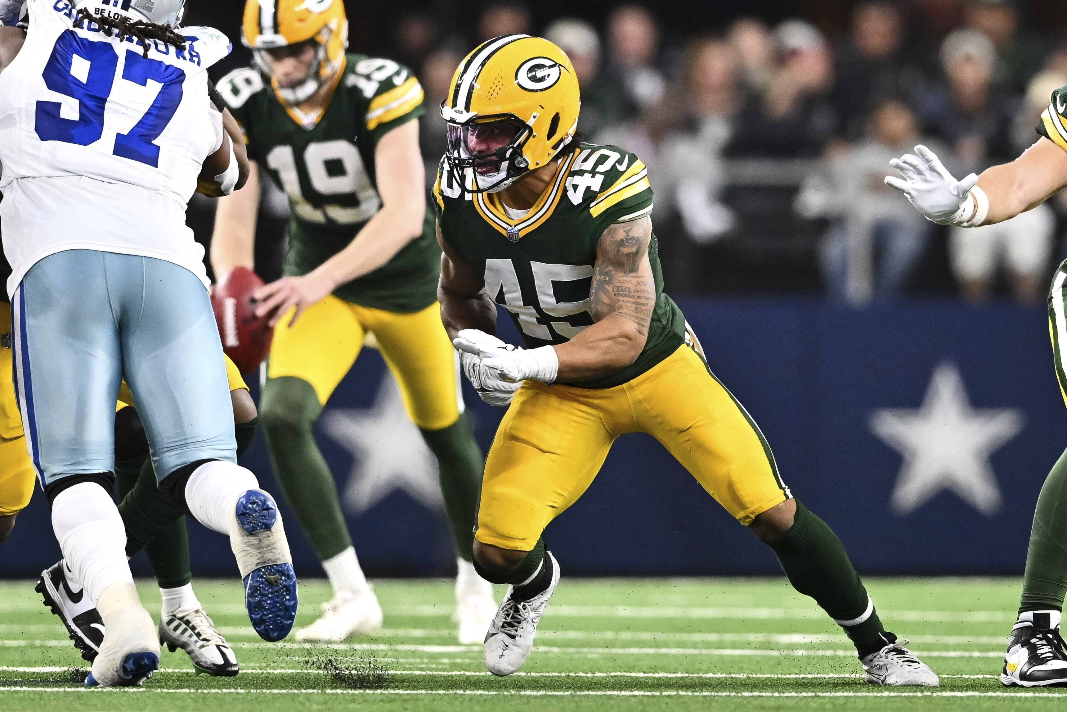 FILE- Green Bay Packers linebacker Eric Wilson (45) rushes during the first half against the Dallas Cowboys of an NFL wild-card playoff football game Sunday, Jan. 14, 2024 in Arlington, Texas. The Bay Packers have boosted their special teams by re-signing linebacker Eric Wilson. 