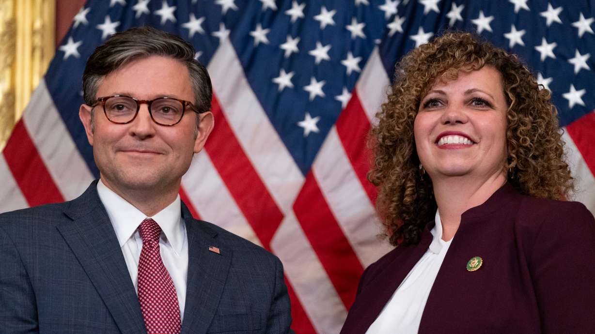 Speaker of the House Mike Johnson, R-La., and newly-appointed Rep. Celeste Maloy, R-Utah, pose on Nov. 28, 2023, on Capitol Hill in Washington. The two share a mutual experience of juggling newly bestowed responsibilities.