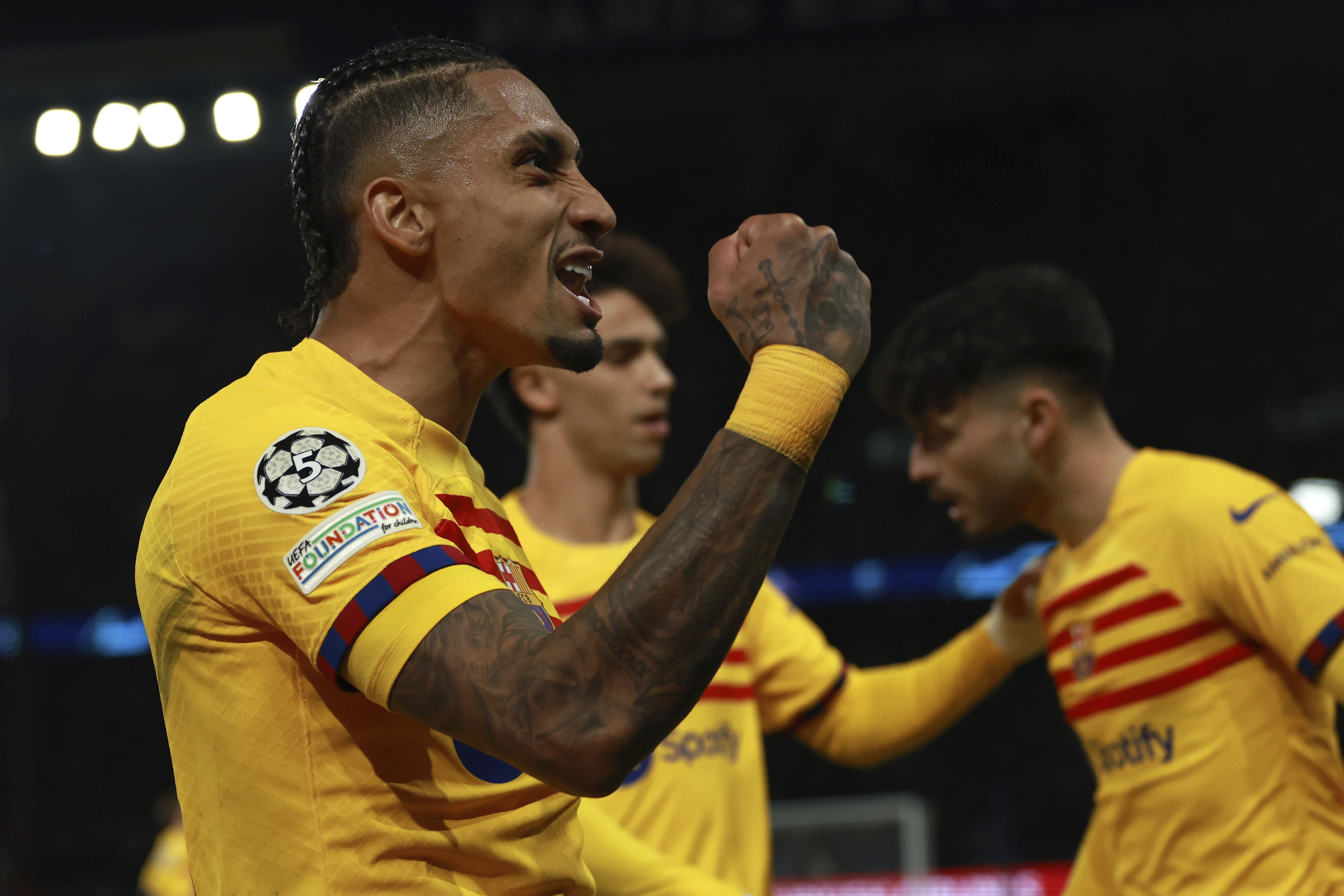 Barcelona's Raphinha celebrates scoring his side's second goal during the Champions League quarterfinal first leg soccer match between Paris Saint-Germain and Barcelona at the Parc des Princes stadium in Paris, Wednesday, April 10, 2024. 