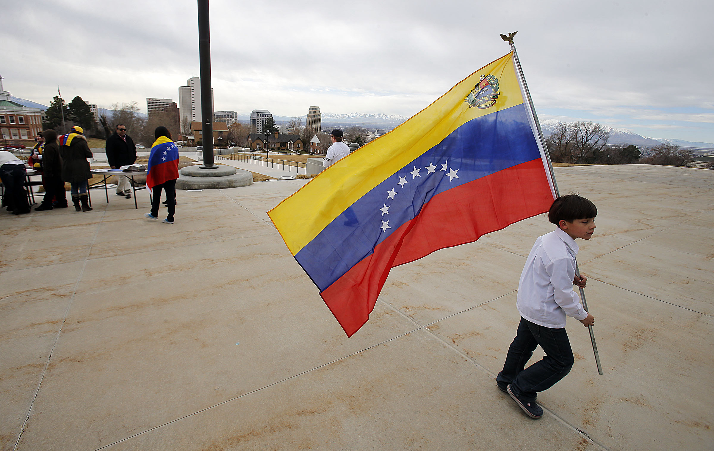 Venezuelans were the largest bloc of newcomers to Utah from 2012-2022, according to numbers released Tuesday. The photo shows a boy carrying a Venezuelan flag at a Feb. 22, 2014, demonstration in Salt Lake City.