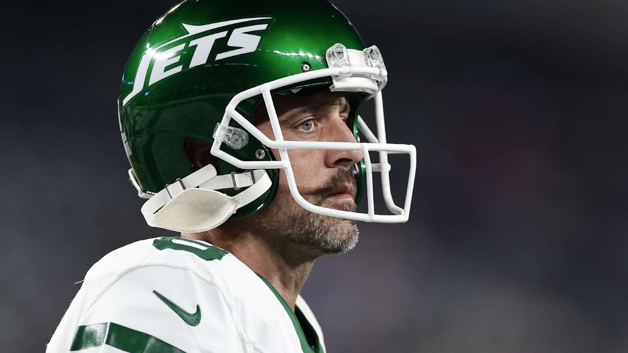 FILE - New York Jets quarterback Aaron Rodgers warms up before playing against the Buffalo Bills in an NFL football game, Sept. 11, 2023, in East Rutherford, N.J. On Tuesday, April 9, 2024, Aaron Rodgers acknowledged during a podcast interview this week he briefly thought his playing career could be over after he tore his left Achilles tendon in the New York Jets’ season opener.