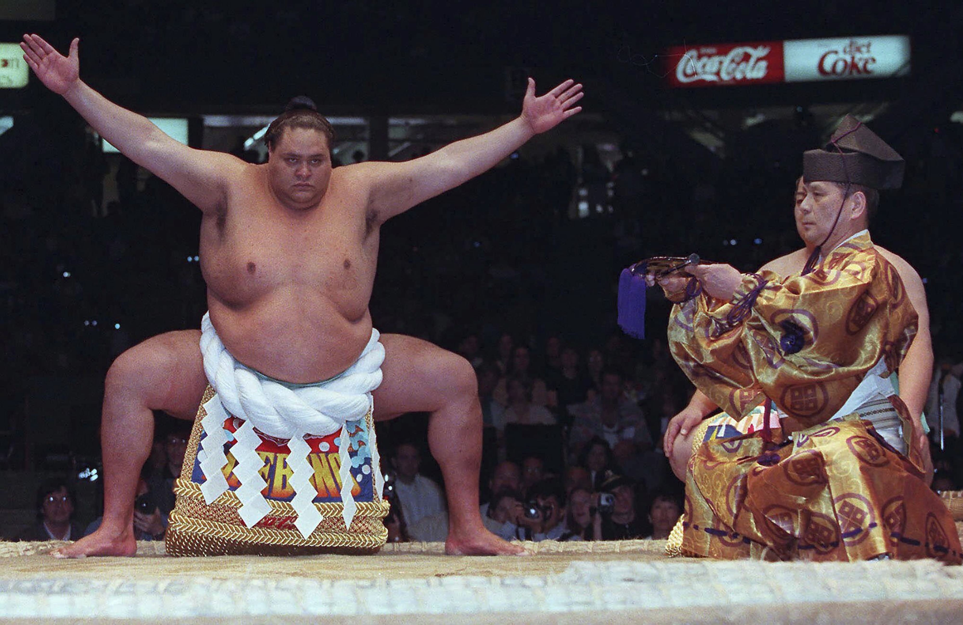 FILE - Hawaiian-born Taro Akebono, Japan's top Sumo wrestler, takes part in a ceremony in the ring prior to competition in Vancouver, British Columbia, on June 6, 1998. Hawaii-born Akebono, one of the greats of sumo wresting and a former grand champion, is reported to have died earlier this month of heart failure while receiving care at a hospital in Tokyo, the United States Forces in Japan said in a statement on Thursday, April 11, 2024. 