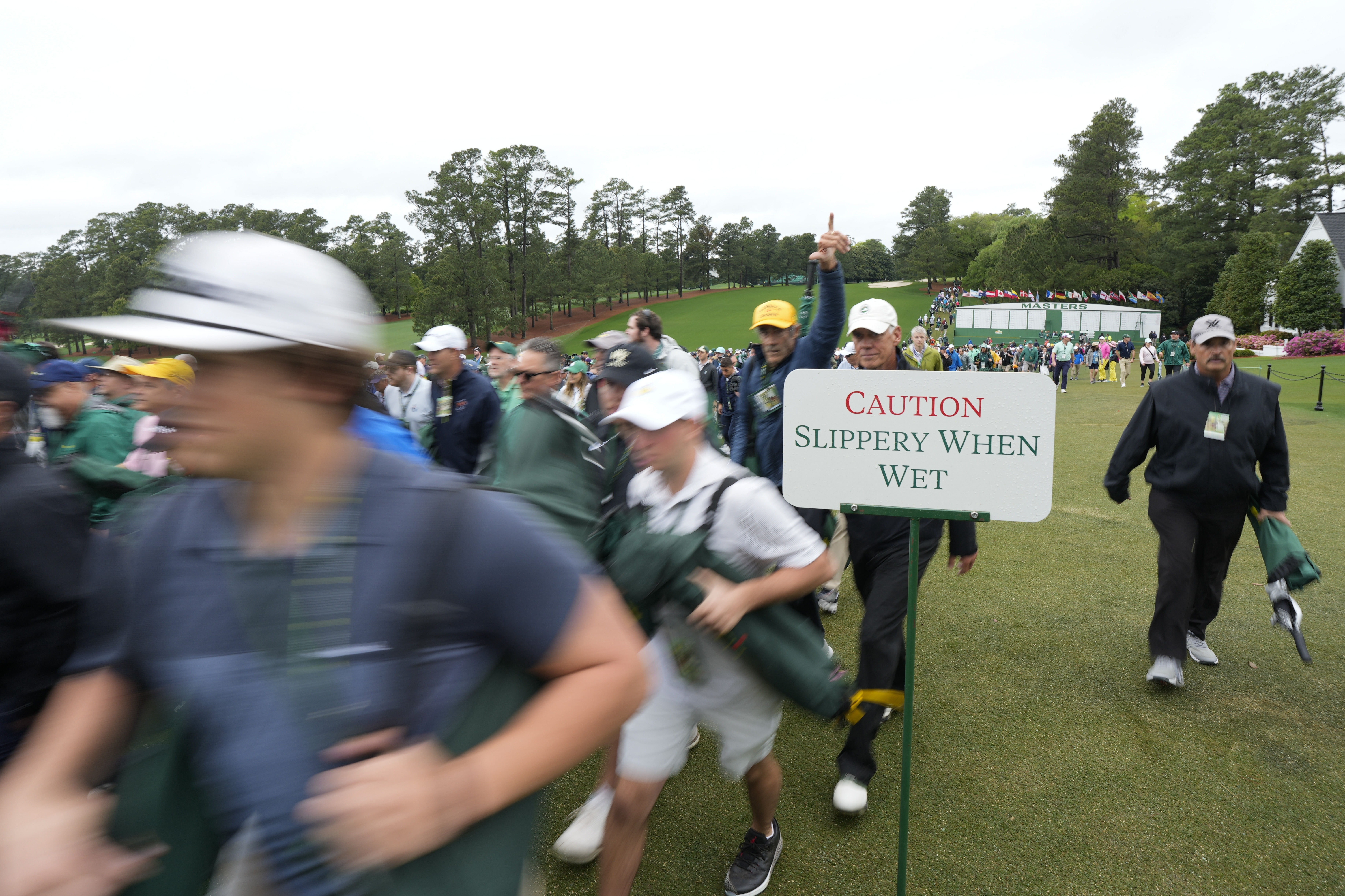 Patrons arrive for the first round during the Masters golf tournament at Augusta National Golf Club Thursday, April 11, 2024, in Augusta, Ga. 