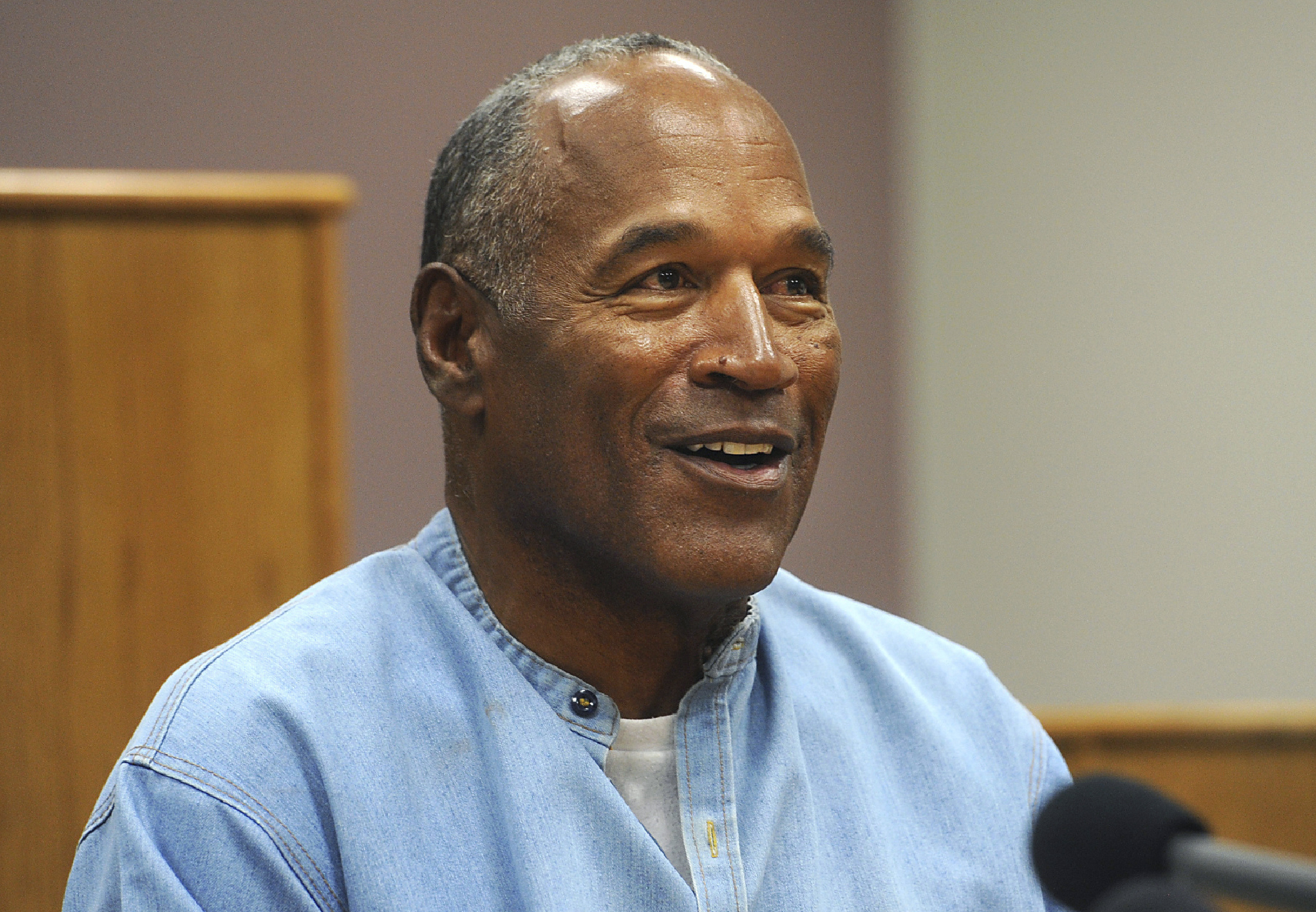 FILE - Former NFL football star O.J. Simpson appears via video for his parole hearing at the Lovelock Correctional Center in Lovelock, Nev., on July 20, 2017. 