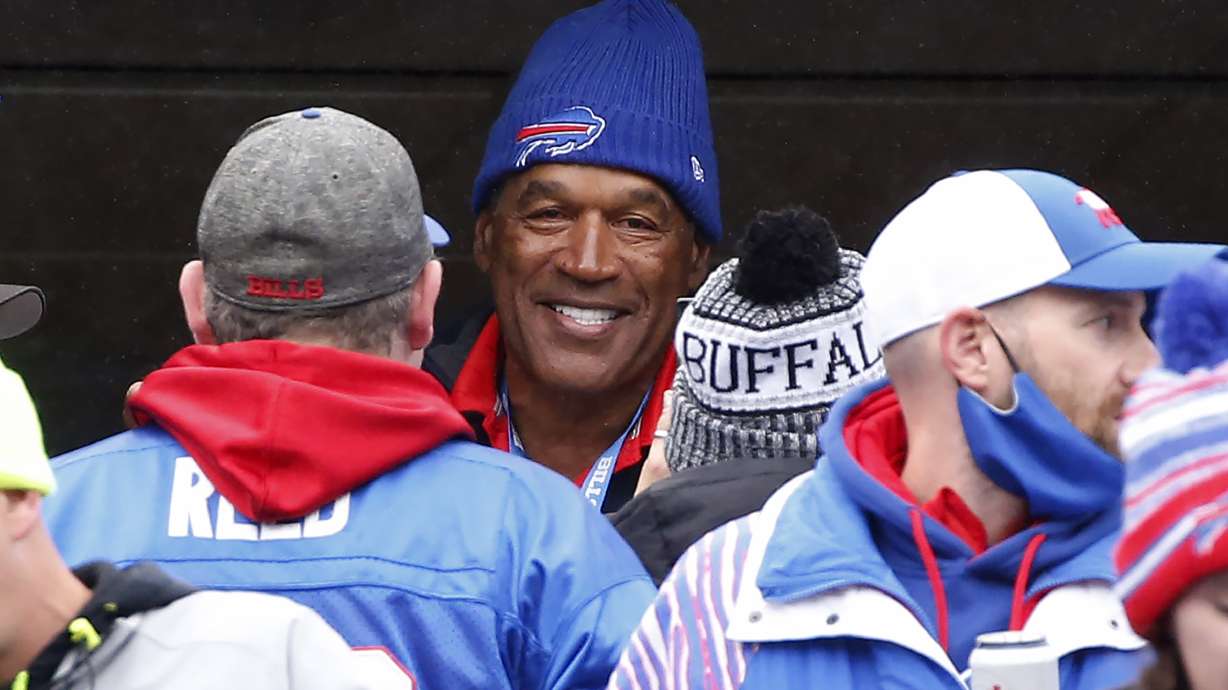 FILE - Buffalo Bills Hall of Fame running back O.J. Simpson with fans prior to an NFL football game against the Miami Dolphins, Sunday, Oct. 31, 2021, in Orchard Park, N.Y. O.J. Simpson, the decorated football superstar and Hollywood actor who was acquitted of charges he killed his former wife and her friend but later found liable in a separate civil trial, has died. He was 76.