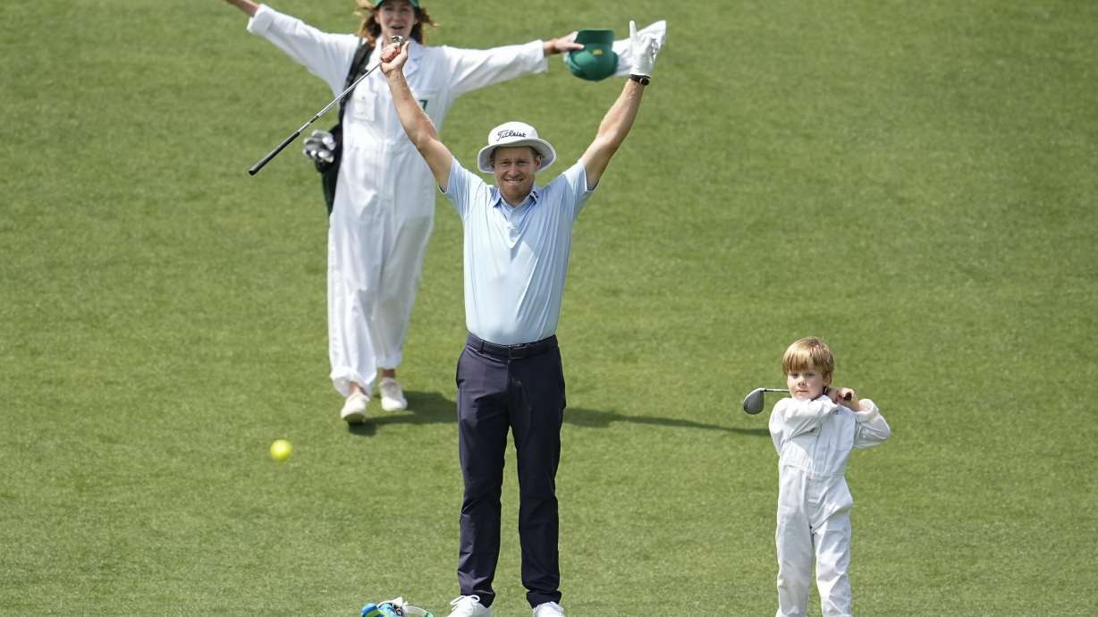 Peter Malnati and his wife Alicia react as their son Hatcher hits on on the fifth hole during the par-3 contest at the Masters golf tournament at Augusta National Golf Club, Wednesday, April 10, 2024, in Augusta, Ga.